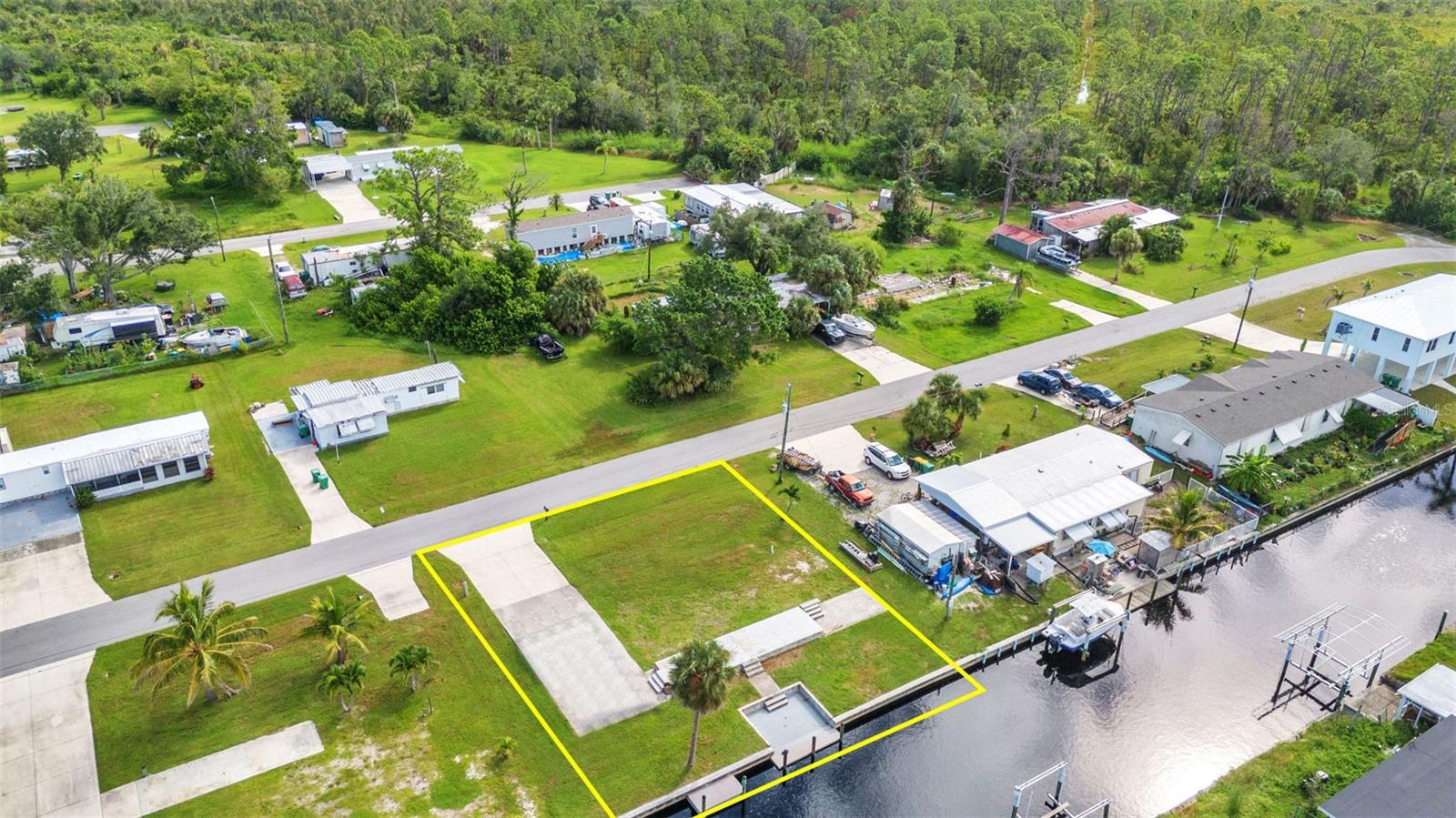 Ready to build your Florida dream home? This 80x100 waterfront lot in historic El Jobean offers the perfect canvas. Known as one of the Gulf Coast’s best-kept secrets, El Jobean was once a lively fishing village and still carries its laid-back charm with live music, local parks, and a welcoming small-town feel.
The property features a solid cement seawall and direct access to deep-water canals — ideal for sailboats and serious anglers alike. With Charlotte Harbor and the Gulf of Mexico just minutes away, you’ll enjoy some of the best fishing waters in the country. Shopping, dining, and recreation are close by, yet the setting retains the relaxed, old Florida atmosphere that makes El Jobean so special.
Build here, and let the magic of coastal living begin.