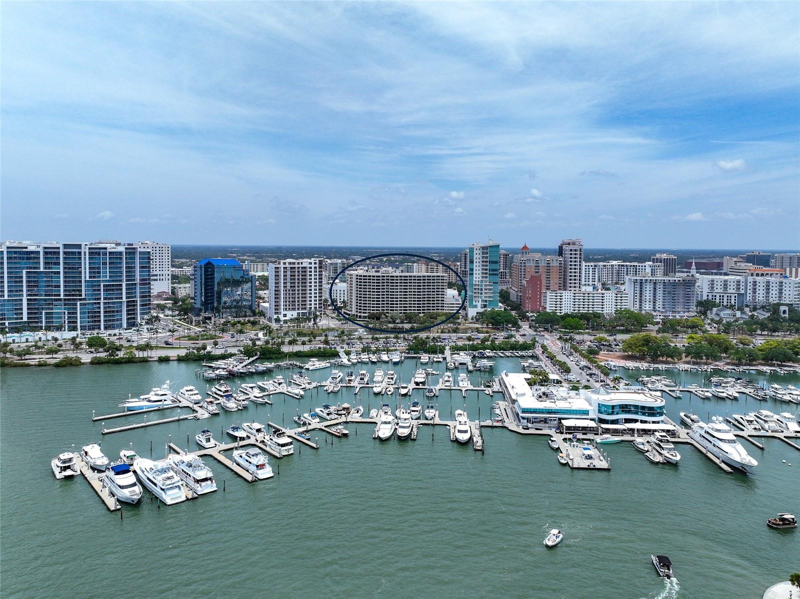 One or more photo(s) has been virtually staged. This extraordinary unit has been exquisitely remodeled to an impeccable standard, utilizing only the finest materials. Every detail has been meticulously crafted to provide an unparalleled luxurious living experience. Prepare to be enchanted by the breathtaking views of Sarasota Bay from three expansive balconies that showcase both waterfront and vibrant downtown panoramas. The sophisticated marble flooring extends seamlessly throughout the entire unit, including the balconies, creating an elegant atmosphere. Eye-catching design elements include brushed gold finishes on all faucets and door handles, low-profile lighting, complemented by custom European doors and exquisite trim work. An open floor plan ensures the views can be enjoyed from every corner of this city dwelling. The modern European kitchen features high-end appliances and elegant finishes, such as marble countertops, a breakfast bar, and a matching backsplash, while maintaining the home's aesthetic. It also includes a convenient service entrance with private laundry facilities. The thoughtfully designed split floor plan guarantees privacy for you and your guests, featuring two primary suite options, each with en suite baths. You can relax in one that has an indulgent soaking tub and dual sinks with LED backlit mirrors, while both include luxurious showers with glass doors and custom fixtures. Plus, this coveted Bay Plaza residence has an exceptional rarity of a third bedroom and third full bath! As a resident, you will enjoy unparalleled amenities, including 24/7 valet parking, convenient EV charging stations, and round-the-clock concierge services that are second to none. The building has recently been transformed with the installation of impact-resistant glass, elevating its sophistication and ensuring both style and safety. Unwind in the luxurious heated swimming pool, soak in the rejuvenating Jacuzzi spa, or maintain your fitness routine in the state-of-the-art fitness room, complete with a European sauna and steam room. Nestled in the heart of downtown Sarasota, this prestigious building is surrounded by various trendy restaurants and boutiques. Residents can effortlessly immerse themselves in the vibrant cultural scene, with Whole Foods, the Theatre, and the Opera just moments away. Enjoy the spectacular 4th of July fireworks at Marina Jacks from the comfort of your balcony. With its unbeatable location just minutes from St. Armands Circle, Longboat Key, and Sarasota’s stunning beaches, this unit offers an unparalleled opportunity to embrace the dynamic social lifestyle that downtown Sarasota proudly provides. Don't miss your chance to make this exquisite residence your own!