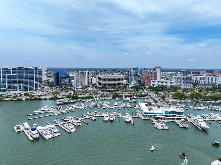 One or more photo(s) has been virtually staged. This extraordinary unit has been exquisitely remodeled to an impeccable standard, utilizing only the finest materials. Every detail has been meticulously crafted to provide an unparalleled luxurious living experience. Prepare to be enchanted by the breathtaking views of Sarasota Bay from three expansive balconies that showcase both waterfront and vibrant downtown panoramas. The sophisticated marble flooring extends seamlessly throughout the entire unit, including the balconies, creating an elegant atmosphere. Eye-catching design elements include brushed gold finishes on all faucets and door handles, low-profile lighting, complemented by custom European doors and exquisite trim work. An open floor plan ensures the views can be enjoyed from every corner of this city dwelling.  The modern European kitchen features high-end appliances and elegant finishes, such as marble countertops, a breakfast bar, and a matching backsplash, while maintaining the home's aesthetic. It also includes a convenient service entrance with private laundry facilities. The thoughtfully designed split floor plan guarantees privacy for you and your guests, featuring two primary suite options, each with en suite baths. You can relax in one that has an indulgent soaking tub and dual sinks with LED backlit mirrors, while both include luxurious showers with glass doors and custom fixtures. Plus, this coveted Bay Plaza residence has an exceptional rarity of a third bedroom and third full bath! As a resident, you will enjoy unparalleled amenities, including 24/7 valet parking, convenient EV charging stations, and round-the-clock concierge services that are second to none. The building has recently been transformed with the installation of impact-resistant glass, elevating its sophistication and ensuring both style and safety. Unwind in the luxurious heated swimming pool, soak in the rejuvenating Jacuzzi spa, or maintain your fitness routine in the state-of-the-art fitness room, complete with a European sauna and steam room. Nestled in the heart of downtown Sarasota, this prestigious building is surrounded by various trendy restaurants and boutiques. Residents can effortlessly immerse themselves in the vibrant cultural scene, with Whole Foods, the Theatre, and the Opera just moments away. Enjoy the spectacular 4th of July fireworks at Marina Jacks from the comfort of your balcony. With its unbeatable location just minutes from St. Armands Circle, Longboat Key, and Sarasota’s stunning beaches, this unit offers an unparalleled opportunity to embrace the dynamic social lifestyle that downtown Sarasota proudly provides. Don't miss your chance to make this exquisite residence your own!