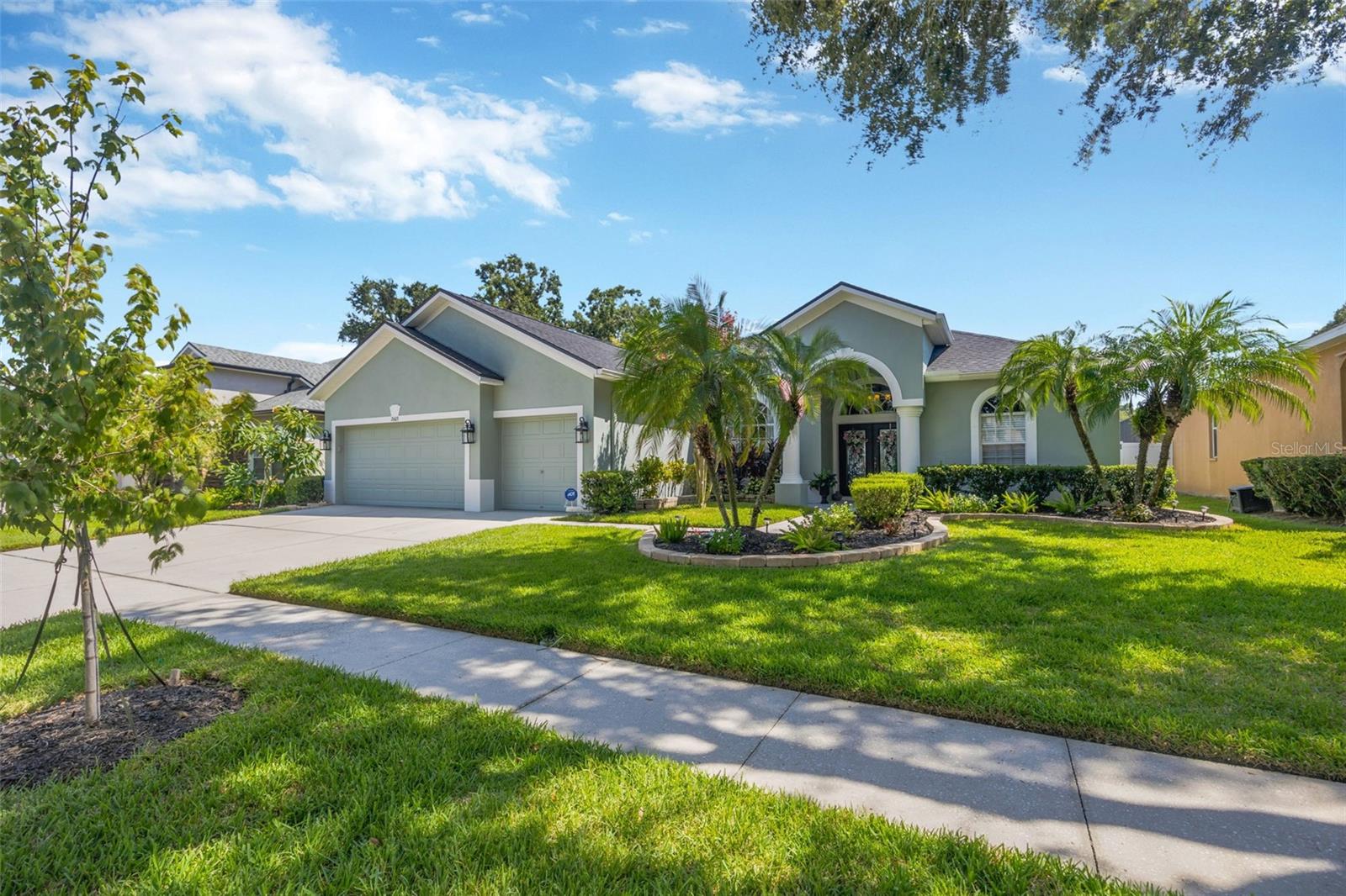 Welcome Home! Come see this beautifully maintained 4 bedroom 3 full bath pool home in the gated community of Bonterra! **Move-in Ready** Bursting with curb appeal, the lush and mature landscaping will instantly make you feel right at home. The open floor plan w/ high ceilings greets you and quickly draws your eye to your private outdoor living space w/ sparkling blue saltwater pool ~ a welcoming space to host family gatherings or unwind w/a cool drink after a stressful day. *Solar panels help keep energy costs low - saving you $$** Large windows throughout allow for expansive pool views from every angle & allow natural light to spill in throughout every room. The floor plan creates a smooth easy flow between the kitchen, family room & outdoor living space, perfect for entertaining! Admire the care and elegance throughout every room creating a perfect blend of modern atheistics and homey feelings! Kitchen includes newer stainless steel appliances, corian counter tops, gas range and an abundance of 42" wood cabinets. Large breakfast bar w/separate eat-in dinette area overlooks the family room, outdoor living space & pool. Spilt floor plan creates a private Owner's Retreat complete with walk in closets & sliding doors leading out to the pool. Ensuite primary bathroom includes dual sinks, large soaking tub w/separate glass shower. The secondary bedrooms are nicely sized with ample closet space featuring built-in closet systems. **Roof 2024, lanai screens 2023, Water Softener 2023, Water Heater 2023, New Interior & Exterior Paint 2023, New Garage Floor Epoxy 2024, & more!** Enjoy the small and quaint gated community of Bonterra - conveniently located to restaurants, entertainment, good school systems and to our amazing Florida beaches & theme parks. Easy commute access to I4, I75 & Crosstown Expressway. Call today for your private showing & experience the Florida lifestyle!