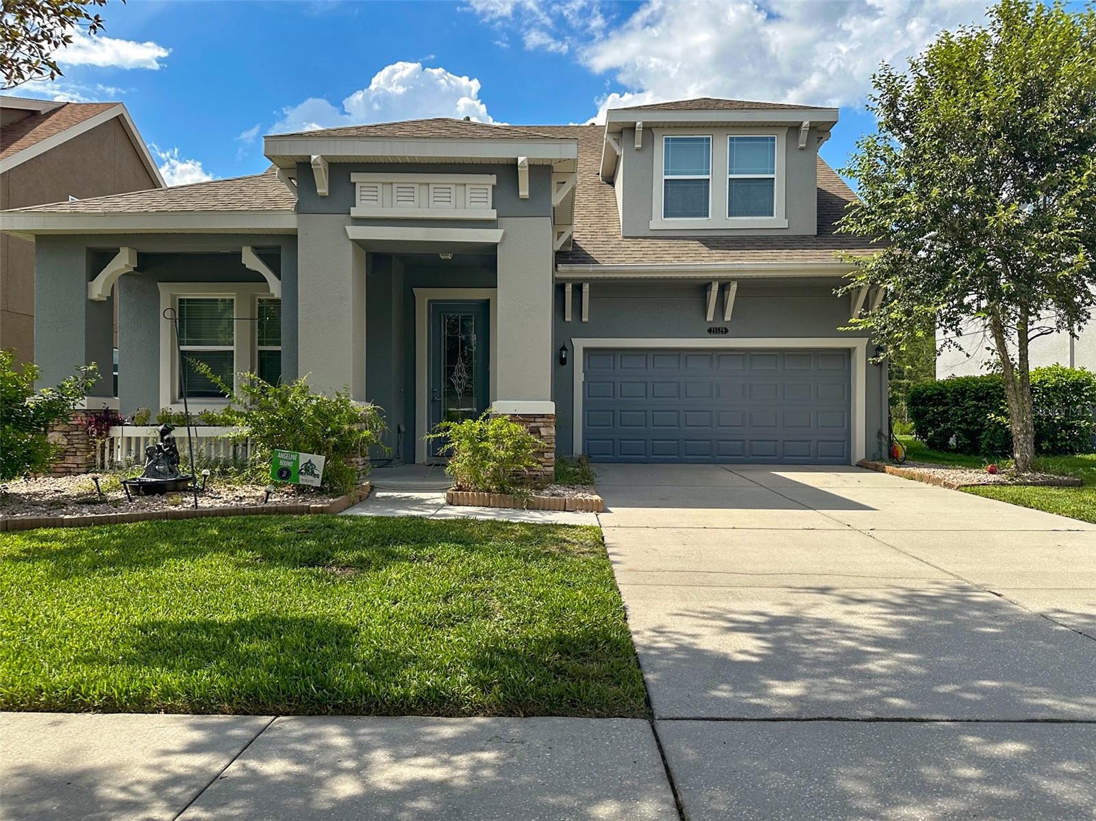 Welcome to this beautiful 4 bedroom with den home in Connerton community of Land O Lakes. In ground heated pool with jacuzzi. Gorgeous view of the lake and trees on the other side of lake. In the kitchen huge kitchen island. 41" cabinets. Crown molding. Stainless steel appliances. Ceiling fans in every room. Tile floors in kitchen, living room, engineered wood floors in bedrooms and den. Interior of the house painted a month ago. Exterior painted in 2024. Central air condition with service contract by Bayonete A/C servicing. Connerton Community Clubhouse has gym, tennis courts, basket ball courts, oversized swimming pool, baby sitting service and a snack bar. Schools and stores in community. Close to major roads. Only about 30 minutes to Tampa International Airport. Along main roads plenty of restaurants, shopping, medical facilities. Make an appointment to see this house and it could be the next place you'll call home. Enjoy Florida living.