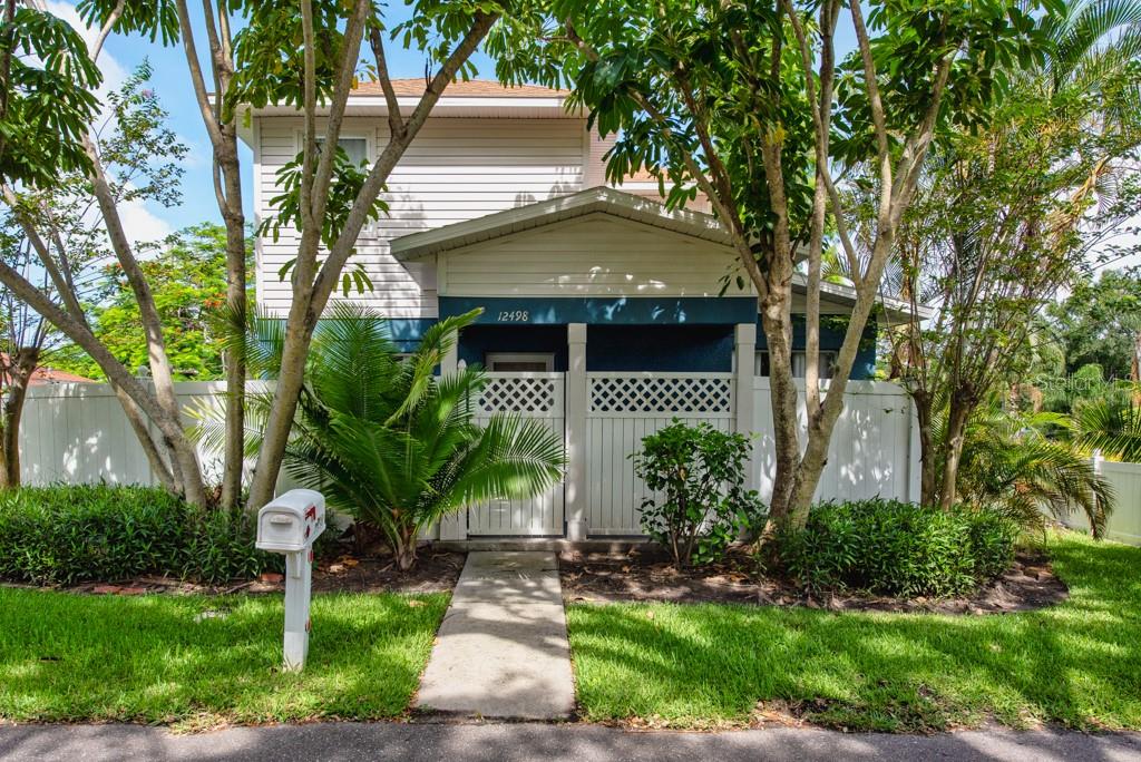 Freshly Updated Gem Near the Intracoastal– Style, Comfort & Convenience in One! Step into this beautifully updated 2-story home offering a rare blend of modern finishes, smart use of space, and a prime location just minutes from the Intracoastal Waterway and Bonner Nature Park. With 2 bedrooms, 2.5 baths, and 1,223 square feet, this inviting residence is designed for comfortable living and easy entertaining. The first floor welcomes you with new waterproof vinyl flooring throughout, giving the home a fresh, modern feel. An open-concept layout creates a spacious flow between the family room and kitchen. Soaring vaulted ceilings and a ceiling fan add to the light and airy atmosphere in the main living area. The fully updated kitchen is a standout feature, offering quartz countertops, white solid wood cabinets, recessed can lighting, and stainless-steel appliances. A pantry provides ample storage, and there’s space for barstools at the counter—perfect for casual dining or entertaining. A separate eat-in dining area completes the space, ideal for daily meals or weekend brunches. Just off the main living space, a versatile bonus room awaits—once a screened porch, now enclosed with stucco walls and its own A/C vent. With sliders leading to the backyard, this flexible area is perfect for a home office, reading nook, or extra living space. Upstairs, both bedrooms are carpeted for comfort and feature private en-suite bathrooms with shower/tub combos, making it ideal for guests or shared living. A large storage closet beneath the stairs offers plenty of room for extra pantry items or household organization. The 1-car garage includes a washer and dryer, which will stay with the home. Outdoors, enjoy a covered porch area on the side of the home and a fully fenced backyard with white vinyl fencing and a storage shed—ideal for gardening tools, bikes, or seasonal décor. Additional updates include a new water heater (2021), a new A/C system (installed 12/2022), and a freshly painted exterior. Ring cameras, window coverings, and furnishings are all negotiable, offering added value and convenience. Whether you're looking for a low-maintenance primary residence, a second home near the water, or a smart investment, this charming property delivers. Thoughtfully updated and move-in ready, all it’s missing is you! Call now and schedule your viewing today!