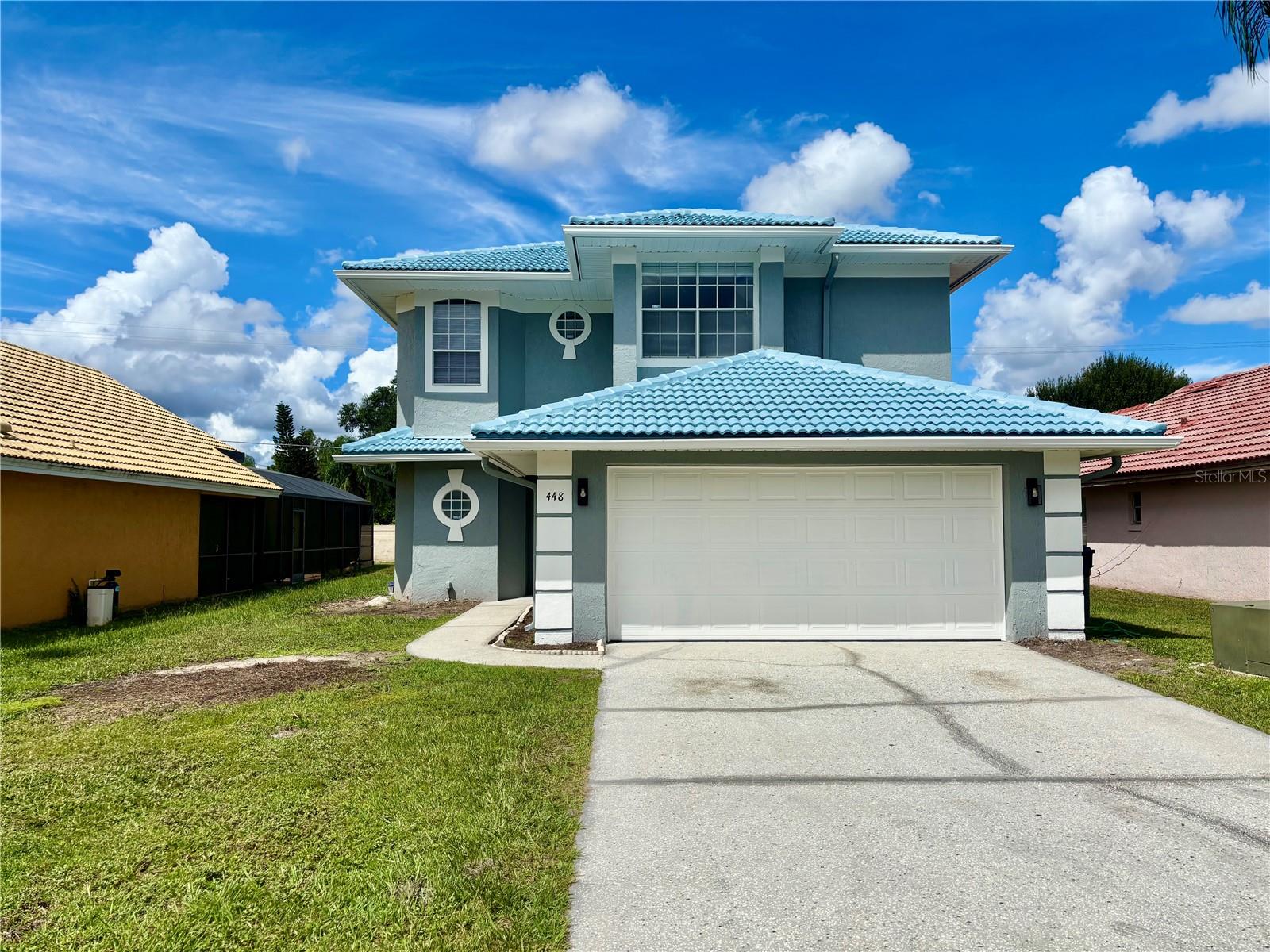 Welcome to the Waterford community! Discover your new home at this beautifully remodeled 3-bedroom, 2.5-bathroom rental property located at 448 Waterford Way, Kissimmee, FL 34746. This stunning home has been meticulously updated from top to bottom, offering a truly modern and move-in-ready living experience. Step inside to find brand-new vinyl flooring and baseboards throughout, complemented by stylish new light fixtures and remote-controlled ceiling fans that provide a modern touch. The entire interior and exterior of the house have been freshly painted, creating a bright and welcoming atmosphere. The bathrooms have been completely upgraded with new toilets, countertops, sinks, faucets, and shower heads, providing a spa-like feel. The kitchen is a chef’s dream, featuring new granite countertops and a full suite of brand-new Whirlpool appliances, including a washer, dryer, microwave, stove, dishwasher, and refrigerator. The new water heater ensures you'll always have a reliable supply of hot water.
The garage has been fully remodeled with a durable epoxy floor and a new garage door with a Wi-Fi-enabled opener and camera, combining style with smart home convenience. The exterior of the property shines with a new pressure-washed driveway and a Spanish tile roof. For your peace of mind, the AC and plumbing systems include a one-year service with Bayonet, and the property also includes a one-year pest control and termite protection plan with Massey. New smoke detectors, curtain rods, and window blinds are also included. This home's location is a major highlight, just two minutes away from a Walmart Supercenter on Vine Street, and conveniently close to popular destinations like Old Town Kissimmee and the Walt Disney World attractions. This home is perfect for those seeking a high-quality rental with all the modern comforts and a prime location. Don't miss the opportunity to live in a house that feels brand new!