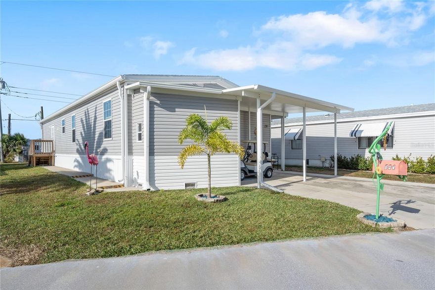 This like-new 2024 Champion manufactured home offers 3 bedrooms, 2 baths, and 1,485 sq ft of comfortable living space in Harbor Cove, a desirable 55+ waterfront community along the Myakka River. As a newer home, it provides the confidence of modern construction and Energy Star–certified efficiency, giving buyers peace of mind and reduced maintenance concerns. Three-bedroom homes are rare here, and this one features an open floor plan, a neutral color palette, and untouched walls that provide a clean blank slate for your personal style. The spacious living room is open to the dining area and kitchen which features stainless steel appliances and center island for prepping and more eating space, a separate interior laundry room houses a full size washer, dryer, and freezer, the large primary bedroom suite has a walk in closet and ensuite bath and two additional bedrooms, each with walk in closets, are near the hall bathroom. Outside find more storage space in the shed under the carport. The home is being sold furnished and includes a golf cart for easy exploring, where you’ll enjoy tropical landscaping and frequent wildlife sightings along the way. With low HOA fees of $175 per month, residents enjoy access to fantastic amenities, including a two-story clubhouse overlooking the marina, two swimming pools, a spa, various sports courts such as pickleball and shuffleboard, a fitness center, craft rooms, and an optional woodworking shop. Harbor Cove also has Gulf access via the river, with boat slip rentals available for only $300 per year. The community is known for its vibrant social calendar offering dances, holiday parties, picnics, card games, entertainment shows, and countless other activities that make it easy to stay active and connected. Conveniently located near shopping, Costco, restaurants, spring training baseball, and beautiful Gulf beaches, this home blends modern reliability, efficiency, and an active Florida lifestyle. Schedule a private tour today!