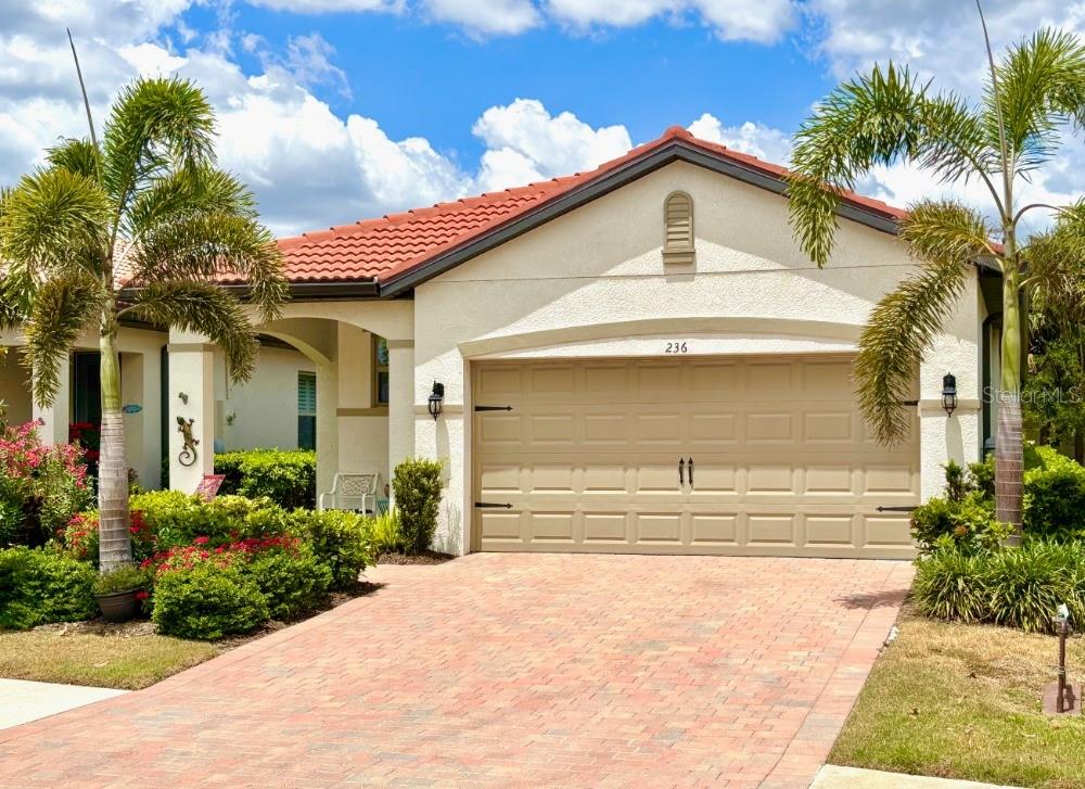 Wonderful opportunity to own a nearly new and well-maintained home in the beautiful resort style community of Toscana Isles, just 4 1/2 miles from Nokomis Beach. This 3 bedroom, 2 bath, single family home is one of the more popular floor plans for its functionality and aesthetics. Lush landscaping, a paver driveway and walkway make your approach inviting. Arches grace the covered entry patio with a lighted front door to illuminate the interior entry, and a hideaway screen door for those cooler days. A bright and functional kitchen with solid wood white cabinetry, quartz counter tops with dazzling herringbone tile backsplash and a large island overlooking the great room. Luxurious trim carpentry finishes from elegant base board and casings to crown molding accent the home including 8-foot raised 6 panel doors. This home boasts contiguous wood plank style ceramic flooring throughout the entire home. The generous main bedroom has a dual lavatory ensuite with walk-in frameless glass shower and a large closet with built in cabinetry offering an abundance of shelving, hanging and storage space. The Garage has a wall of cabinets and heavy-duty shelving you will discover we all need. The community of Toscana Isles is renowned for it's luxurious infrastructure from bridges and fountains, expansive lakes and an amenity center with an abundance of features. Activities include tennis, pickleball, bocce ball, playground and a dog park, bring your kayak or canoe and plow the lakes or fish from the community dock. There is a fitness center, infinity edge pool, billiards room and BYOB bar along with activity rooms and on-site management to assist with event planning. Nestled between Sarasota and Venice offering the best of both, with shopping, dining and entertainment all close by. The Sarasota Memorial Hospital's new campus is a few minutes away. The proximity to both the Legacy Trail and the Myakka river makes this the perfect location for a dynamic lifestyle. Schedule your showing soon!