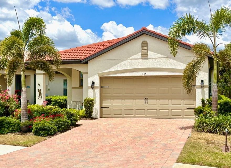 Wonderful opportunity to own a nearly new and well-maintained home in the beautiful resort style community of Toscana Isles, just 4 1/2 miles from Nokomis Beach. This 3 bedroom, 2 bath, single family home is one of the more popular floor plans for its functionality and aesthetics. Lush landscaping, a paver driveway and walkway make your approach inviting. Arches grace the covered entry patio with a lighted front door to illuminate the interior entry, and a hideaway screen door for those cooler days.  A bright and functional kitchen with solid wood white cabinetry, quartz counter tops with dazzling herringbone tile backsplash and a large island overlooking the great room. Luxurious trim carpentry finishes from elegant base board and casings to crown molding accent the home including 8-foot raised 6 panel doors. This home boasts contiguous wood plank style ceramic flooring throughout the entire home. The generous main bedroom has a dual lavatory ensuite with walk-in frameless glass shower and a large closet with built in cabinetry offering an abundance of shelving, hanging and storage space. The Garage has a wall of cabinets and heavy-duty shelving you will discover we all need. The community of Toscana Isles is renowned for it's luxurious infrastructure from bridges and fountains, expansive lakes and an amenity center with an abundance of features. Activities include tennis, pickleball, bocce ball, playground and a dog park, bring your kayak or canoe and plow the lakes or fish from the community dock. There is a fitness center, infinity edge pool, billiards room and BYOB bar along with activity rooms and on-site management to assist with event planning. Nestled between Sarasota and Venice offering the best of both, with shopping, dining and entertainment all close by. The Sarasota Memorial Hospital's new campus is a few minutes away. The proximity to both the Legacy Trail and the Myakka river makes this the perfect location for a dynamic lifestyle. Schedule your showing soon!