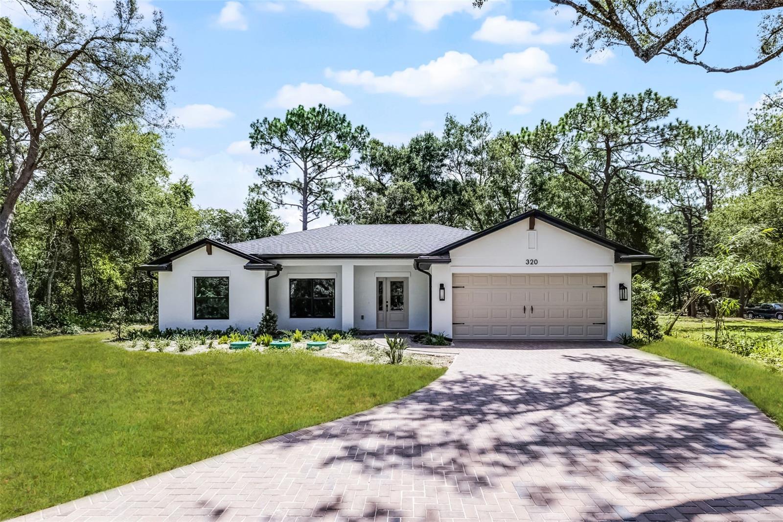 Brand new luxurious custom built home on a private secluded street on almost half an acre in a beautiful part of Orange City, just a mile or so from Blue Springs State Park. Property has plenty of room to park an Rv, Boat, or have a large storage shed/workshop on property. Chickens are also permitted in this neighborhood. The home is equipped with state of the art upgrades and finishings were chosen by a professional interior designer. Home is on city water and private sewer. 60 Foot paver driveway and private side street allows you to access the home from two different neighborhoods. Amazing location and home waiting for YOU.