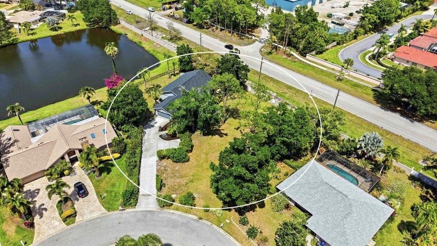 Enjoy peace of mind in this beautifully updated home, perfectly situated on an oversized 0.43-acre lot offering exceptional privacy and space. Thoughtfully upgraded with major improvements, this property is truly move-in ready.
Recent updates include a new roof (2025), A/C (2020), and plumbing (2016), along with stylish interior upgrades completed in 2023 featuring gorgeous wood flooring, a fully renovated kitchen, and a luxurious bathroom with high-end finishes. New interior doors and modern light fixtures.
The desirable split floor plan and high ceilings create a bright, open layout ideal for both everyday living and entertaining. Step outside to the  oversized screened lanai with tranquil water views—perfect for relaxing or hosting guests—with plenty of room to add your dream pool.

Enjoy a low annual HOA fee of just $420 and optional golf membership nearby at Palm Aire Country Club.
Located just minutes from The Mall at University Town Center, downtown Sarasota, Lido Beach, and St. Armands Circle, this home offers the perfect blend of convenience and lifestyle.