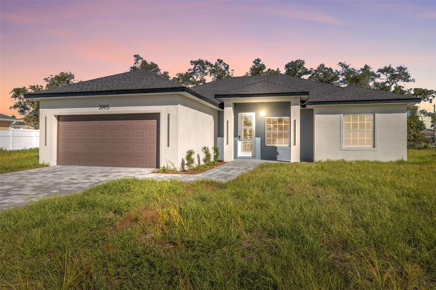 Welcome to 3995 SW 134th St, a charming Ocala residence in the heart of Marion Oaks, offering modern comfort and timeless design. This inviting single-level home showcases a bright open floor plan with seamless flow between the living, dining, and kitchen areas—perfect for everyday living and entertaining. The kitchen features generous counter space, contemporary cabinetry, and stainless-steel appliances. The primary suite offers a spacious walk-in closet and private bath, while two additional bedrooms provide flexibility for guests or a home office. Enjoy the tranquility of a fenced backyard ready for gatherings or future enhancements. Conveniently located near Marion Oaks Community Center, 1.0 mi to Winn-Dixie, 1.4 mi to Marion Oaks Elementary, and 2.2 mi to Walgreens, with easy access to I-75, shopping, and dining.