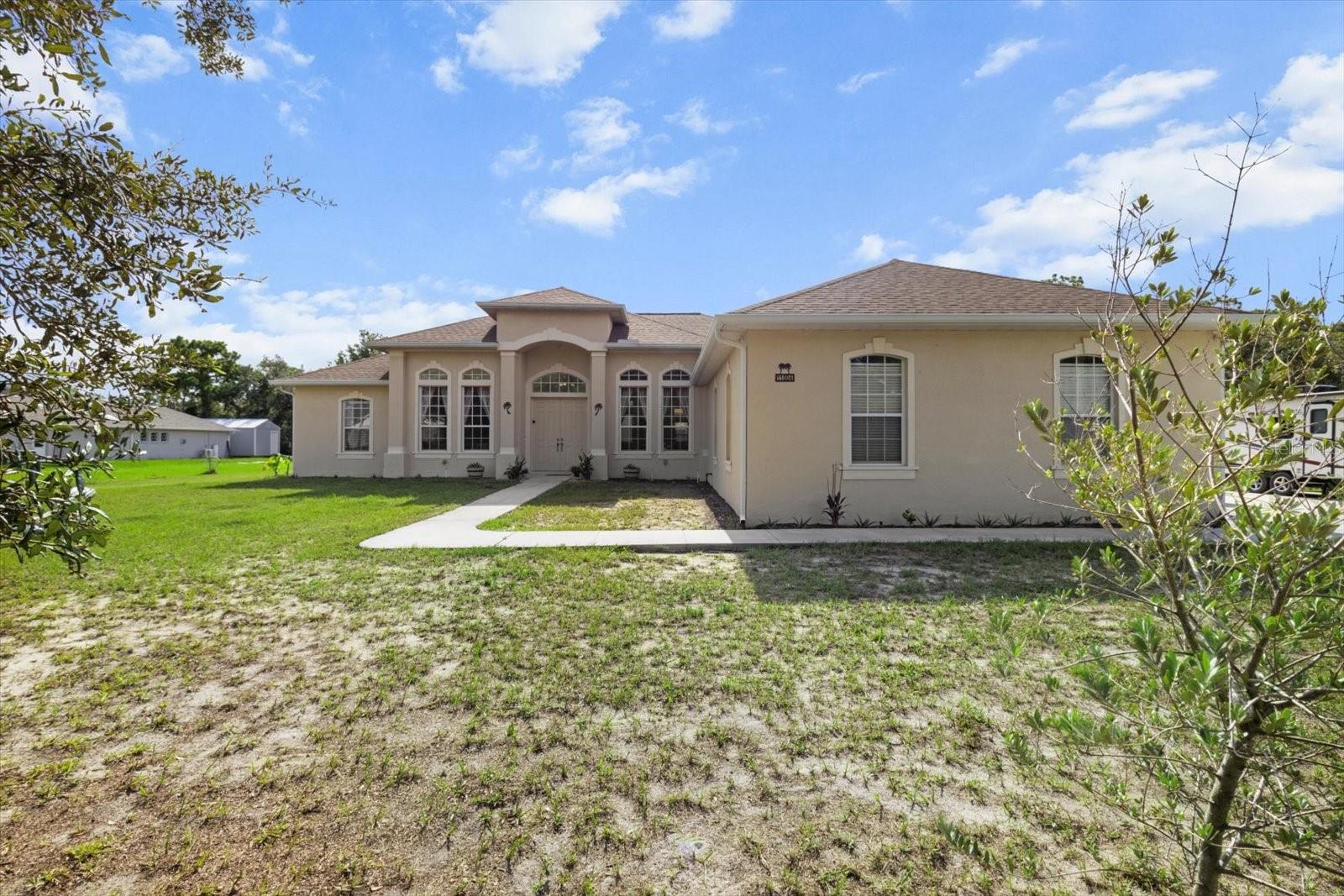 Sprawling Weeki Wachee Estate on Nearly an Acre – No HOA, No CDD, Endless Possibilities!
Welcome to your ultimate blank canvas! This massive 4-bedroom, 3-bathroom residence offers an impressive 3,375 square feet of living space on a peaceful .88-acre oversized lot in the heart of Weeki Wachee — with no HOA and no CDD restrictions!
Built in 2005 and boasting a new roof (2022), this home has been thoughtfully maintained and includes all major appliances: refrigerator, stove, microwave, dishwasher, and water heater. Whether you’re dreaming of a multigenerational setup or just craving extra space, you’ll fall in love with the private in-law suite featuring a spacious 12x6 walk-in closet, ensuite bath, and private sliding door entry to the backyard — ideal for future pool bath conversion. From the moment you step inside, you’re greeted with towering ceilings, luxury vinyl plank flooring, and multiple living areas that give this home a sense of grandeur. The open-concept kitchen is a chef’s dream with a massive center island, huge walk-in pantry, and seating for five or more around the bar — perfect for entertaining on a grand scale. The formal dining room, second living area, and pocket sliders leading to the screened-in back patio add even more functional living space to enjoy Florida’s indoor-outdoor lifestyle. The primary suite is a true retreat — spanning 30x17.5 feet and featuring an attached 13.5x14’ den with dual closets, ideal for a home office, gym, or nursery. The ensuite bathroom offers dual vanities, a soaking tub, walk-in shower, and private water closet, along with a jaw-dropping 21-foot deep walk-in closet that’s ready to impress even the biggest wardrobe! And let’s not forget the oversized 3-car garage (24x36’) with 8-foot doors, and oversized driveway providing ample space for cars, toys, or even a workshop. Step outside to your private courtyard with pavers — the perfect space to relax, entertain, or build your dream pool oasis. With mature landscaping and room to grow, this property is a rare find in one of Weeki Wachee’s most desirable areas. The possibilities are endless — personalize, upgrade, expand, or simply enjoy the generous space and privacy this home provides. Whether you’re looking to upsize, invest, or create a multigenerational haven, this is the one you’ve been waiting for. (Roof 2022-Well Tank Replaced 12/2024-Septic Drain Field 2021-AC 2 Units (2005 & 2019)- Located in the peaceful and picturesque community of Weeki Wachee, just minutes from shopping, dining, state parks, and the crystal-clear waters of the Weeki Wachee River. Schedule your private showing today — this incredible value won’t last long!