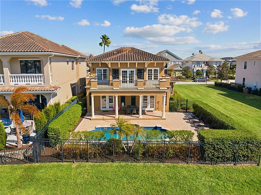 Wake up to golf course views and end your day poolside in this well appointed 5-bedroom Reunion retreat overlooking the legendary Jack Nicklaus Tradition course. With no rear neighbors and seamless indoor-outdoor living, this home delivers the privacy and resort lifestyle buyers dream about. The bright, open floor plan centers around a spacious gourmet kitchen and airy living room with French doors leading to your private backyard oasis. A first-floor primary suite and additional ensuite guest room provide comfort and convenience, while the upstairs loft and three more bedrooms create the perfect space for hosting family and friends. Located inside Reunion Resort with access to the private on-site water park,  three championship golf courses, community pools, several dining options, and endless recreation, this home is equally suited as a luxury residence, vacation escape, or income-producing rental. **Active membership in place**