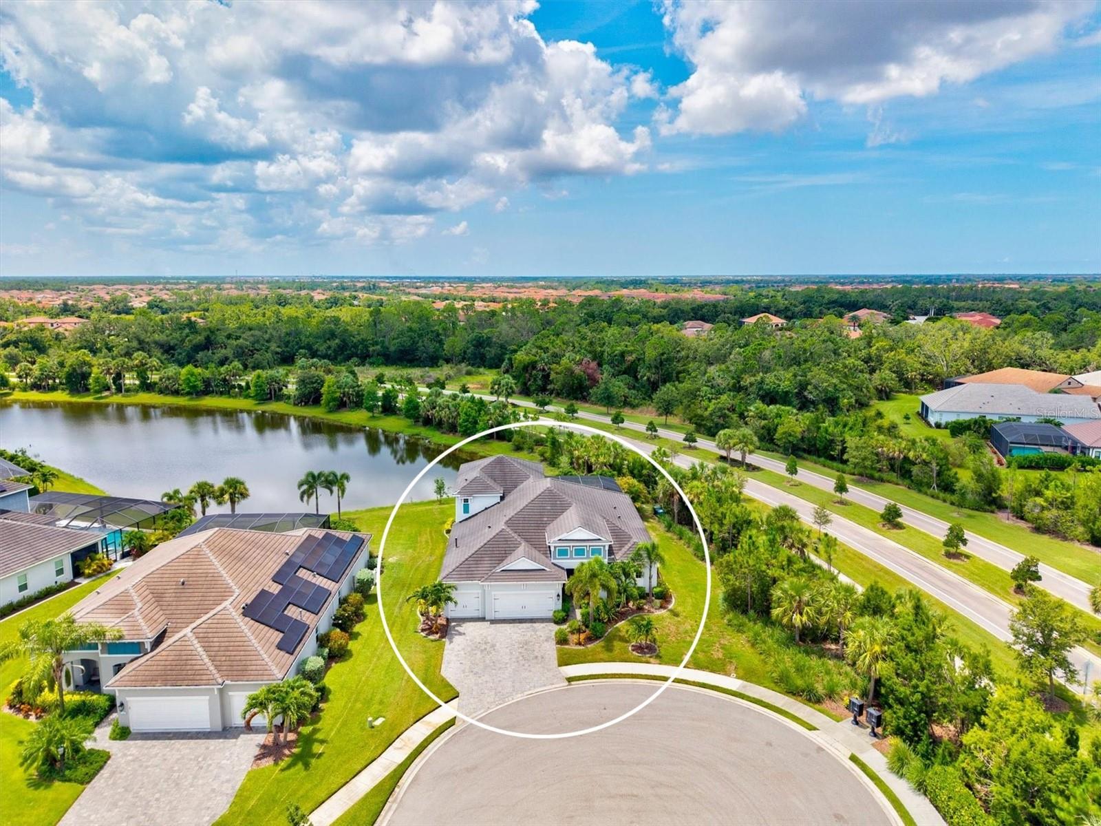 Discover a rare opportunity at 12301 Auburndale Court, an exceptional residence tucked away at the end of a quiet cul-de-sac in Venice’s highly sought-after Grand Palm community. Homes like this are seldom available—a true standout offering space, privacy, and thoughtful design throughout.
Built in 2019 and showcasing Neal’s desirable Kiawah floor plan, this beautifully maintained, one-owner home offers 5 bedrooms, 4 bathrooms, and over 3,700 square feet of refined living space, all situated on an expansive 11,000+ square-foot homesite with a coveted southern exposure.
The first floor features four spacious bedrooms, all with upgraded custom closets, an oversized office with French doors for quiet focus, and a stylish club room perfect for relaxing or entertaining. The gourmet kitchen is the heart of the home, featuring 42” white cabinetry, granite countertops, subway tile backsplash, premium stainless steel appliances, a walk-in pantry, and elegant pendant lighting—a dream for any chef.
Step outside and you’ll feel like you’re at a private resort. The outdoor living area is an entertainer’s paradise with a custom saltwater pool, sun shelf, and gas heater for year-round enjoyment. Enjoy serene lake views from the spacious lanai, which offers a cozy sitting area with fire pit, a dining space for gatherings, and a complete outdoor kitchen featuring a LION grill, refrigerator, sink, stone accents, granite counters, and a tiki-hut-inspired bar seating area—all designed for the ultimate Florida lifestyle.
The generous 3-car garage is fully tiled and flexible enough to serve as a fitness space, workshop, or simply protect your vehicles in style.
Not in a flood zone. This home offers low-maintenance living with an irrigation system and in-wall pest control. It sustained no damage during recent hurricanes, giving added peace of mind.
Located in the sought-after Grand Palm community, residents enjoy an unmatched resort lifestyle: multiple clubhouses and pools, basketball, tennis, pickleball, bocce ball, and beach volleyball courts, playgrounds, a splash pad, dog parks, scenic nature trails, a state-of-the-art fitness center, library, and a vibrant activities center.
This home’s prime location puts you close to everything — less than 4 miles to downtown Wellen Park, under 10 miles to historic Downtown Venice Avenue, and just 9 miles to the Venice Fishing Pier and waterfront dining at Sharky’s and Fin’s at Sharky’s. The Atlanta Braves Spring Training complex is only 4.1 miles away, offering games and live events. Plus, the brand-new Costco is just 3.3 miles away, and I-75 is under 4 miles for easy commuting.
Luxury, convenience, and location come together here — don’t miss this rare opportunity. Schedule your private showing today!