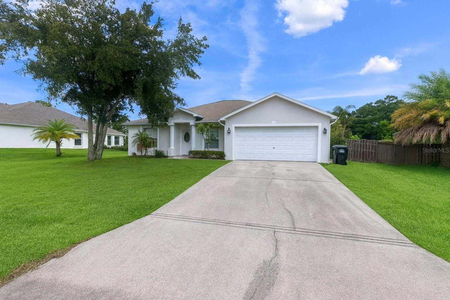 Welcome to this beautifully maintained 3-bedroom, 2-bathroom home in desirable Port Malabar Unit 46! Built in 2003, this spacious residence offers over 2,000 sq ft of living space on an oversized 0.32-acre lot. Step inside to find a bright and open floor plan featuring a large living room, formal dining area, and a separate family room. The kitchen offers plenty of cabinet space, a breakfast bar, and overlooks the family area perfect for entertaining.
The primary suite includes a walk-in closet and private bath, while the two additional bedrooms provide generous space for family or guests. Enjoy Florida living outdoors with a large patio and private backyard, ideal for relaxing or gatherings.
Additional highlights include a 2-car garage, concrete block construction, and a homestead tax exemption. Conveniently located near shopping, dining, schools, and major roadways, this home combines comfort and convenience.
Don’t miss your chance to make this Palm Bay gem yours schedule a showing today!