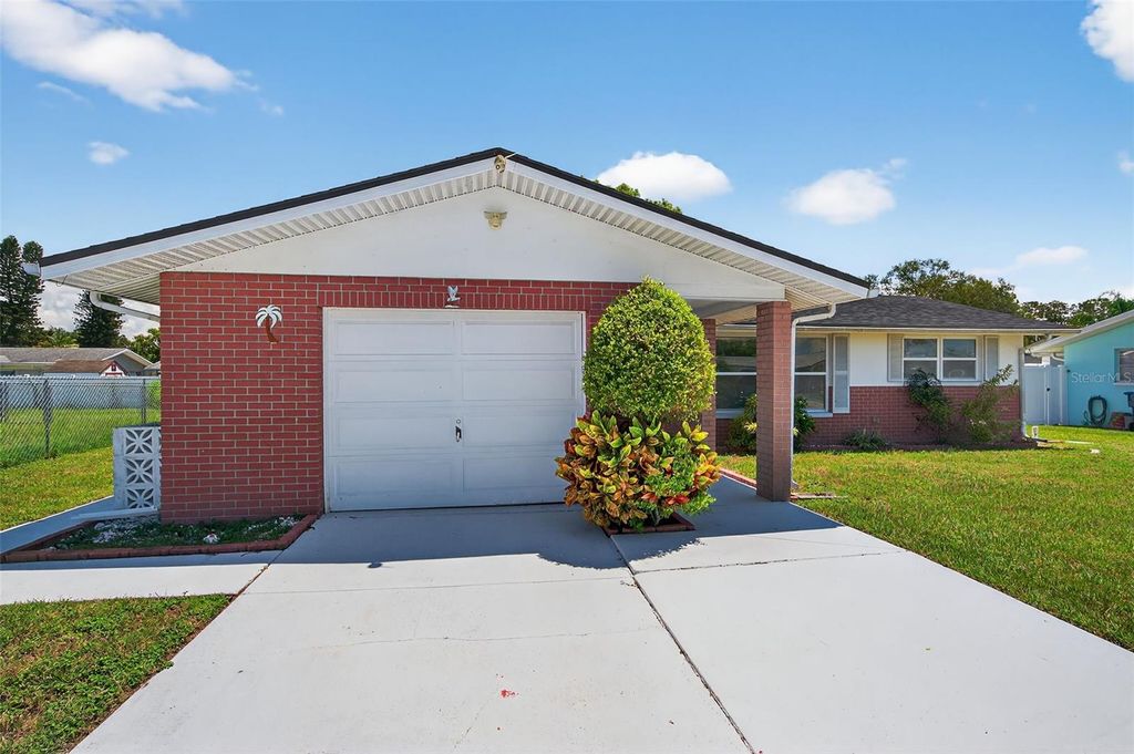 Photo of 10404 Loquat Drive, Port Richey, FL 34668 (MLS # TB8420356)