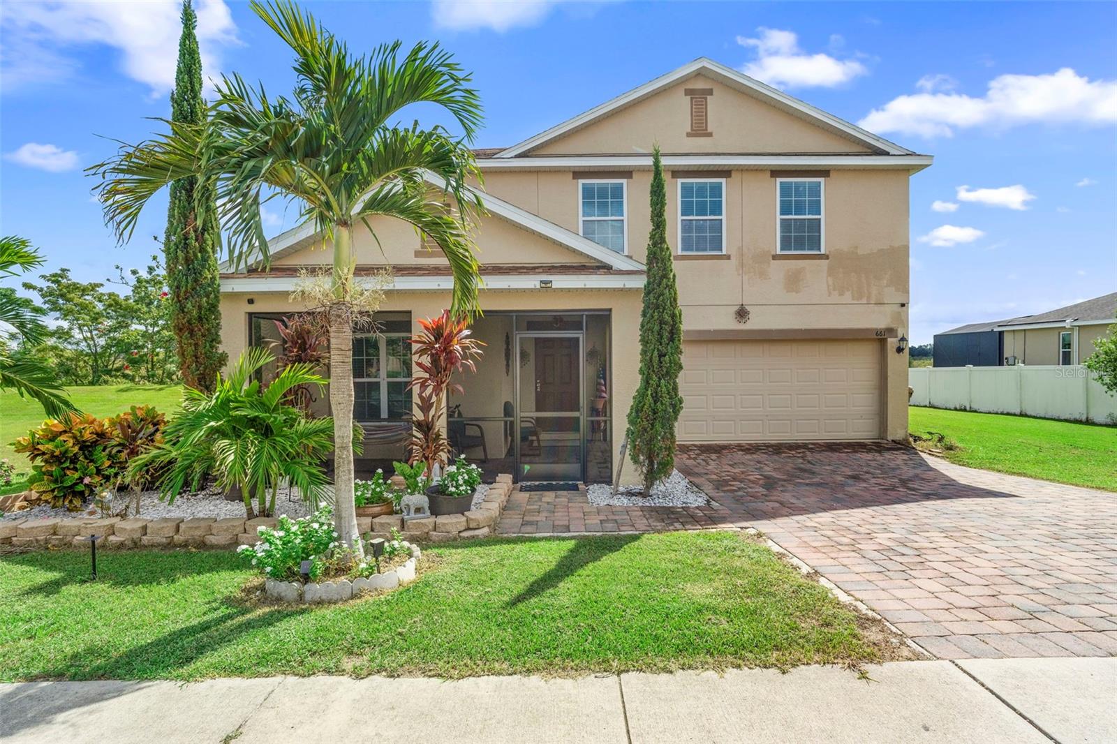WELCOME TO YOUR WATERFRONT DREAM HOME OASIS IN GROVELAND!
This move-in ready, 5-bedroom, 3-bathroom lakefront home is nestled on a spacious half-acre corner lot with no rear neighbors, offering the perfect combination of privacy, space, and natural beauty. With direct access to the Lake County Chain of Lakes, this is truly a waterfront dream home oasis—ready for you to add your own dock and enjoy boating, jet skiing, and endless lakefront adventures right from your backyard.
Step inside to the welcoming formal sitting and dining areas, perfect for hosting guests or enjoying quiet evenings. From there, the home opens into a grand kitchen with a massive island, granite countertops, and 42-inch cabinets, seamlessly flowing into the spacious great room—the heart of the home and an ideal gathering space for family and friends.
This thoughtfully designed floor plan offers two primary suites for ultimate flexibility—one located on the main floor, perfect for guests or multigenerational living, and another upstairs, providing a private retreat with a luxurious en-suite bath and walk-in closet. Three additional bedrooms and a versatile loft area will give you even more room to spread out.
Then step outside into your private backyard retreat—a true extension of your home and lifestyle. Picture yourself sipping morning coffee in the enclosed lanai, surrounded by lush greenery and birdsong. In the evening, gather with loved ones under the stars by the crackling firepit, or stroll through the yard filled with ornamental and fruit trees, picking fresh fruit as you go. With no rear neighbors, you’ll enjoy serene privacy as you take in breathtaking sunsets over the water—every day feels like a mini getaway.
Additional highlights include a brand-new stove/oven and microwave, and monthly A/C servicing for comfort and peace of mind.
Located in the sought-after Eagle Pointe community, this home combines elegance, functionality, and true lakefront living.