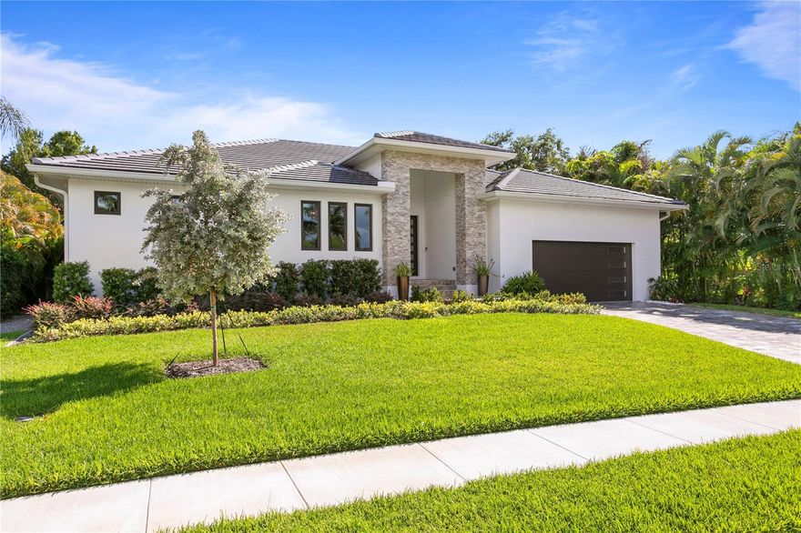 Presenting an exquisite, smartly designed home meticulously crafted to the highest standards, boasting a seamless blend of elegance and functionality. This contemporary residence welcomes you with an entrance of travertine stone, setting the tone for the exceptional quality within. Step inside to discover the luxurious Duchateau wide plank vinyl flooring, renowned for its stylish appearance and long-lasting durability.  The grandeur continues with soaring ceilings and a generously proportioned living area, featuring two sets of double sliding doors that seamlessly connect the indoors with the outdoor oasis that spans the entire width of the home. Prepare to be amazed by the magnificent chef's kitchen, boasting an oversized Taj Mahal Quartzite Counter, offering ample space for culinary endeavors. Sleek cabinetry conceals clever pull-out features, complete with electrical outlets, ensuring convenience is always within reach. There is a spacious hidden walk-in pantry adding to the ample storage. Top-of-the-line appliances include a Wolf 36” Gas cooktop, Wolf oven, microwave/convection oven, and a Subzero refrigerator.  The kitchen is also equipped with a Sub-zero icemaker and a dedicated beverage area. Adjacent to the stunning living and dining areas, you'll find an executive office or media room, as well as a sizeable walk-in laundry room. The owners' suite is a haven of tranquility, featuring a spa-style bathroom with an oversized walk-in shower and double vanities. His and her walk-in closets are easily accessible.  The master suite also offers direct access to the outdoor living area, effortlessly blending indoor and outdoor living.  The guest wing of this remarkable residence comprises two generously sized bedrooms, each boasting its own bathroom for optimal privacy. Step outside to discover over 2,000 square feet of outdoor living enveloped by lush landscaping, providing a sanctuary of seclusion. The screened area, adorned with shell stone patio decking, is a true entertainer's paradise, featuring sonis sound system, a quartz counter bar with ample seating, and a remarkable cooking area complete with a TEC outdoor grill, Manitowac outdoor icemaker, and sleek Nature Kraft outdoor cabinets with stainless steel pulls. The Pebble-tec pool is enhanced with a tiled waterfall with multiple LED lighting color options creating an enchanting ambiance near the relaxing hot tub.  To top it all off, this home is equipped with solar heating, water filtration system, and electric charging station in the two car garage, ensuring energy efficiency and eco-conscious living. In summary, this awe-inspiring residence from 2022 sets a new standard of luxury living, boasting meticulous craftsmanship, a thoughtfully designed floorplan, and a harmonious integration of indoor and outdoor spaces. Pasadena Yacht and County Club is a Guard Gated Community located on an 18-hole championship Golf Course, with Marina, and water access to wide open Boca Ciega Bay and the Gulf of Mexico. Resort style amenities include: Tennis, Pickleball, Jr. Olympic Pool, Pool Bar, Gym, There is indoor dining, a Golf shop, fitness center.  Different membership options available.  Conveniently located within 30 minutes of Tampa Int’l Airport, and within 10 minutes to all the venues in downtown St. Petersburg and close to Gulf Beaches.