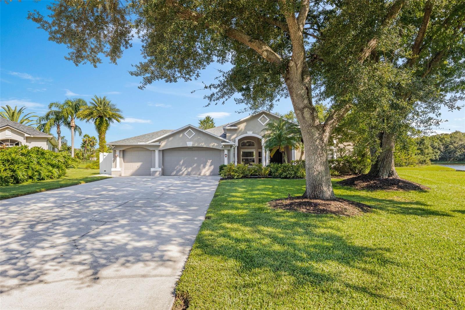 Welcome to this gorgeous 4-bedroom, 3-bath POOL home! The tranquil WATER VIEWS and outdoor living space that truly make this home unforgettable! It’s perfectly situated on a cul-de-sac with an exceptionally long driveway and 3 CAR GARAGE. From the moment you arrive, the curb appeal sets the tone!
Inside, the open floorplan is bright and welcoming, with soaring 10-foot ceilings and plenty of natural light. Entertain with ease, with a beautiful island with a breakfast bar and separate formal living and dining rooms. The kitchen is gorgeous and features granite countertops, stainless steel appliances, generous cabinet space, and a pantry, all overlooking the living room. A cozy fireplace in the living room adds warmth and charm year-round.
The primary suite offers a peaceful retreat with 2 large walk-in closets and ensuite bath featuring 2 vanities, makeup desk, a soaking tub, and a separate stand up shower. There’s even an attached bonus room that would make a great home office, work out room, or nursery! The 3 additional rooms are very spacious, while two additional full baths add comfort and convenience.
Step into the backyard and you’ll find your own peaceful and private retreat: a sparkling screened in SALTWATER POOL, an EXTENDED PATIO, and sweeping views of TWO SERENE PONDS where DEER and other wildlife visit daily. Whether you’re swimming, lounging, or enjoying dinner on the patio, this is the place where relaxation comes naturally.
This home is located in a peaceful, amenity-rich community with one of the lowest HOA fees in the area, yet offers resort-style amenities including a community pool, clubhouse, fitness center, basketball and volleyball courts, and shaded walking trails under majestic oak trees. It's just minutes from the Tampa Premium Outlets, The Grove, The Krates, movie theaters, golf courses, highly rated schools, top medical facilities, and tons of dining and shopping options. Plus, you’re close to I-75/I-275 with quick access to Tampa, Lakeland, and even Orlando, without the long, congested drives similar in other neighborhoods. This home checks every box: private pool, tranquil pond views, a great floor plan, low HOA, and 3 car garage! Schedule a showing today!