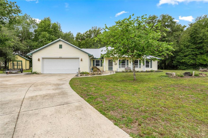Custom-built 4-Bedroom 2-Bathroom home on 1.9 acres in Vermillion Estate, ideally located between Ocala and The Villages. Agricultural zoning allows horses, goats, chickens, and more. Built in 2015, this move-in ready home features 2,152 sq ft under A/C, a metal roof, an open split floor plan, tile flooring throughout, granite countertops, kitchen island, central vacuum system, surround sound wiring, and screened lanai. Enjoy peaceful outdoor living with two waterfall ponds, fire pit, butterfly garden, wooded backyard, and added privacy at the end of a cul-de-sac. Located in the heart of horse country near Florida Horse Park, this property offers beautiful low-maintenance landscaping and plenty of room to enjoy peaceful country living.