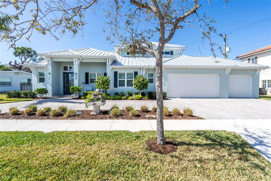 Stylish and elegant home situated in the heart of historic downtown Venice just a short walk to Venice's Mainstreet. This 2 years young home is a designer masterpiece with so many custom features. There are 3 bedrooms, and 3.5 baths, den with en-suite, 3-car garage, pool, spa, large lanai perfect for entertaining friends & family, and the kitchen is a chef's dream. Fabulous cabinets and Island that is a work of art itself with rich tea cabinets, granite counters and seating for 4, gas cooktop, walk-in pantry with light sensor and lovely dining room overlooking the pool through a large single window. The color palette throughout this home is gorgeous. The master suite is on the first floor with 2 walk-in closets and a bathroom with 2 vanities, walk in show and luxurious soaker tub. Also downstairs in a den/office with an en suite with walk in shower, perfect for guests or in-laws,  privacy. Upstairs you will find 2 guest rooms and a full bath. the details throughout make this home truly special like the built-in bench with storage, tray ceilings, all the closets have light sensors, a large laundry with storage, and downstairs powder room, incredible chandeliers and lighting, and whimsical glass door knobs and cabinet pulls throughout. Plantation shutters adorn the windows creating a sophisticated look this open concept floor plan. You will be safe from any weather with all hurricane impact windows and doors. Entertain on or in your fenced backyard and take in all the beautiful landscaping or relax around your pool and spa.  This home offers quick walking distance to historic downtown Venice, shopping, dining, Venice Theatre, the Venice Art Center, library, entertainment, and medical facilities.  Bike to Venice beach and catch a sunset!  Call today to preview this spectacular home today!