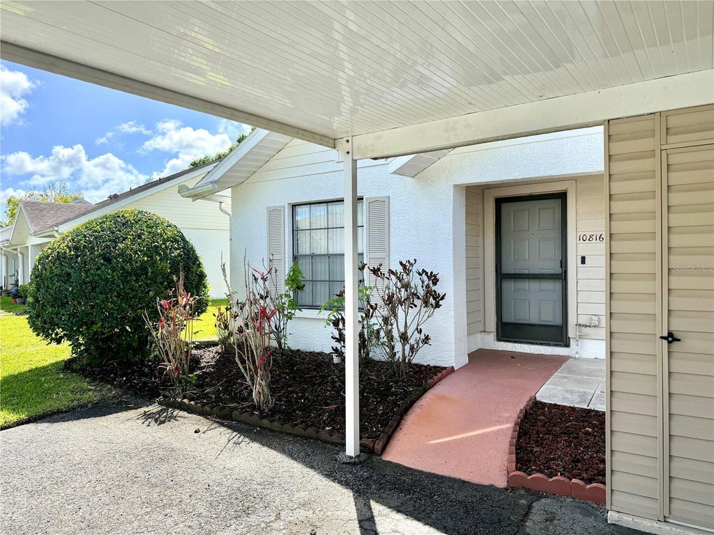 Photo of 10816 Laquinta Drive, New Port Richey, FL 34654 (MLS # TB8554685)