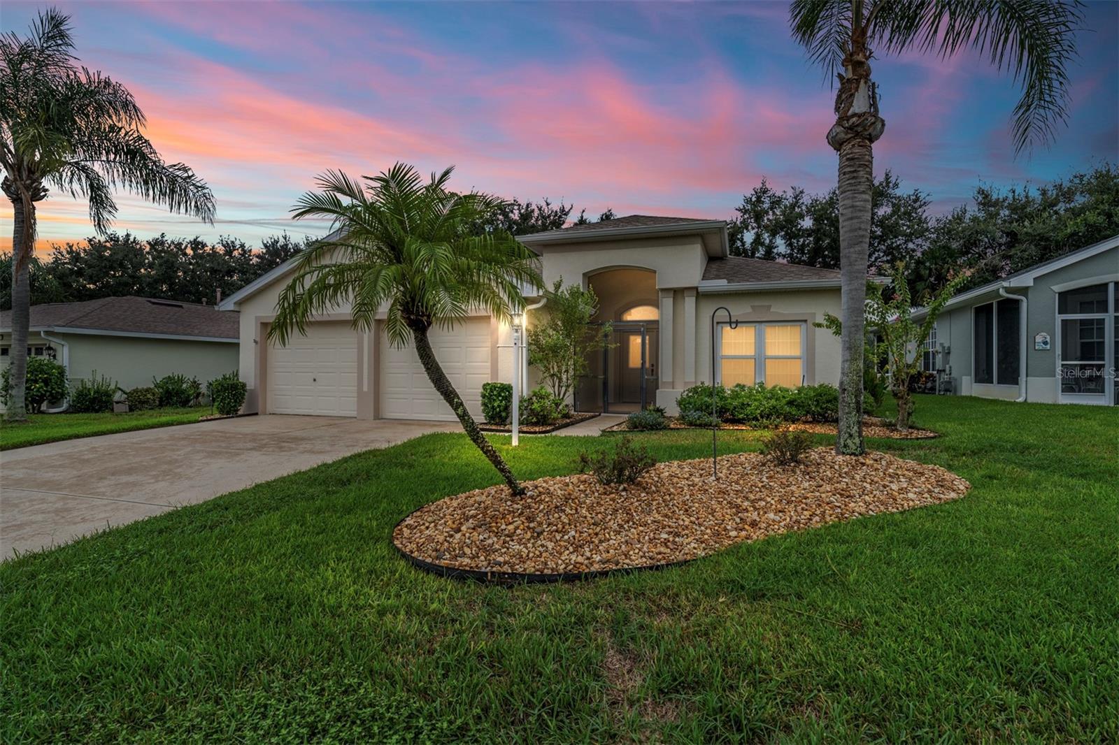 Looking for a home that’s been truly cared for and thoughtfully updated? This charming 3-bedroom, 2-bathroom property has so much to offer. You’ll love the peace of mind that comes with a new roof and gutters in 2023, a new A/C system in 2022, a water heater added in 2023, and updated windows in 2021. To top it off, a whole-house generator was installed in 2024, so you’ll stay cool and comfortable during any power outages.
Inside, the layout is bright and open with plenty of room to spread out. And let’s talk about this oversized kitchen. Whether you’re a chef who loves to cook or a baker who needs lots of counter space for trays of cookies to cool, this kitchen delivers. With an abundance of cabinetry, generous counter space, two sinks, a center island with built-in Jenn-Aire flat top, and space for a full-size dining table, it’s designed for both function and flair.
You’ll also find two separate living areas that offer flexibility for relaxing, entertaining, or pursuing hobbies. The formal dining room adds a touch of elegance for special meals, while the third bedroom with pocket doors makes a great space for any of your needs.
Large windows let in plenty of natural light, and the private paver patio out back gives you a quiet space to unwind. Located in Legacy, a beautifully kept 55+ gated community, you’ll enjoy access to a clubhouse, pool, fitness center, and a full calendar of activities if you choose to join in.
Convenient to shopping, restaurants, and medical care, this home offers both comfort and convenience with all the big-ticket updates already done. Ready to take a look? Let’s get your showing scheduled.