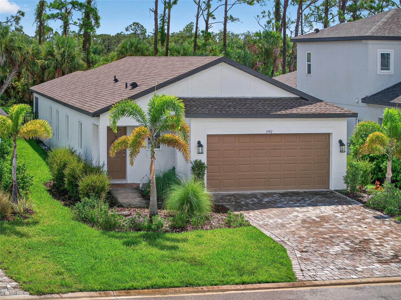 AMAZING PRICE! BEAUTIFUL 3 BED, 2 BATH, 2-CAR GARAGE PRIVATE POOL HOME IN THE HAMMOCKS AT WEST PORT! Seller upgrades include contemporary lighting and ceiling fans, glass shower door in primary bath, and extended landscaping. Beautiful open floor plan features tray ceilings and neutral décor creating a bright and airy ambiance throughout. Well-appointed kitchen offers 42” tall white cabinetry with crown molding, stainless appliances, pendant lighting, closet pantry, center island with breakfast bar plus casual dining area. Primary suite features large walk-in closet and private bath with dual sinks and upgraded glass walk-in shower. Split floor plan provides guests with plenty of privacy with 2 additional bedrooms with full guest bath in front of home. Outside enjoy the panoramic screened lanai with the saltwater heated pool overlooking the private backyard with preserve views. West Port is new community conveniently located between SR 776 and US 41 surrounding Centennial Park and Recreation Center with nature trails, lakes for fishing, playground, state-of-the-art fitness center, aquatic facility plus much more. Pedestrian friendly community where sidewalks, pathways and trails offer residents miles of walking, jogging and bicycling opportunities. Great location close to Murdock restaurant and shopping district, Charlotte Sports Park, Fairgrounds, schools, golf and a short drive to SWFL gulf beaches and downtown Punta Gorda with award winning fishing and boating plus community events and entertainment. Don’t miss this opportunity to make this exceptional home your new permanent residence or Florida retreat! Schedule your private showing today!