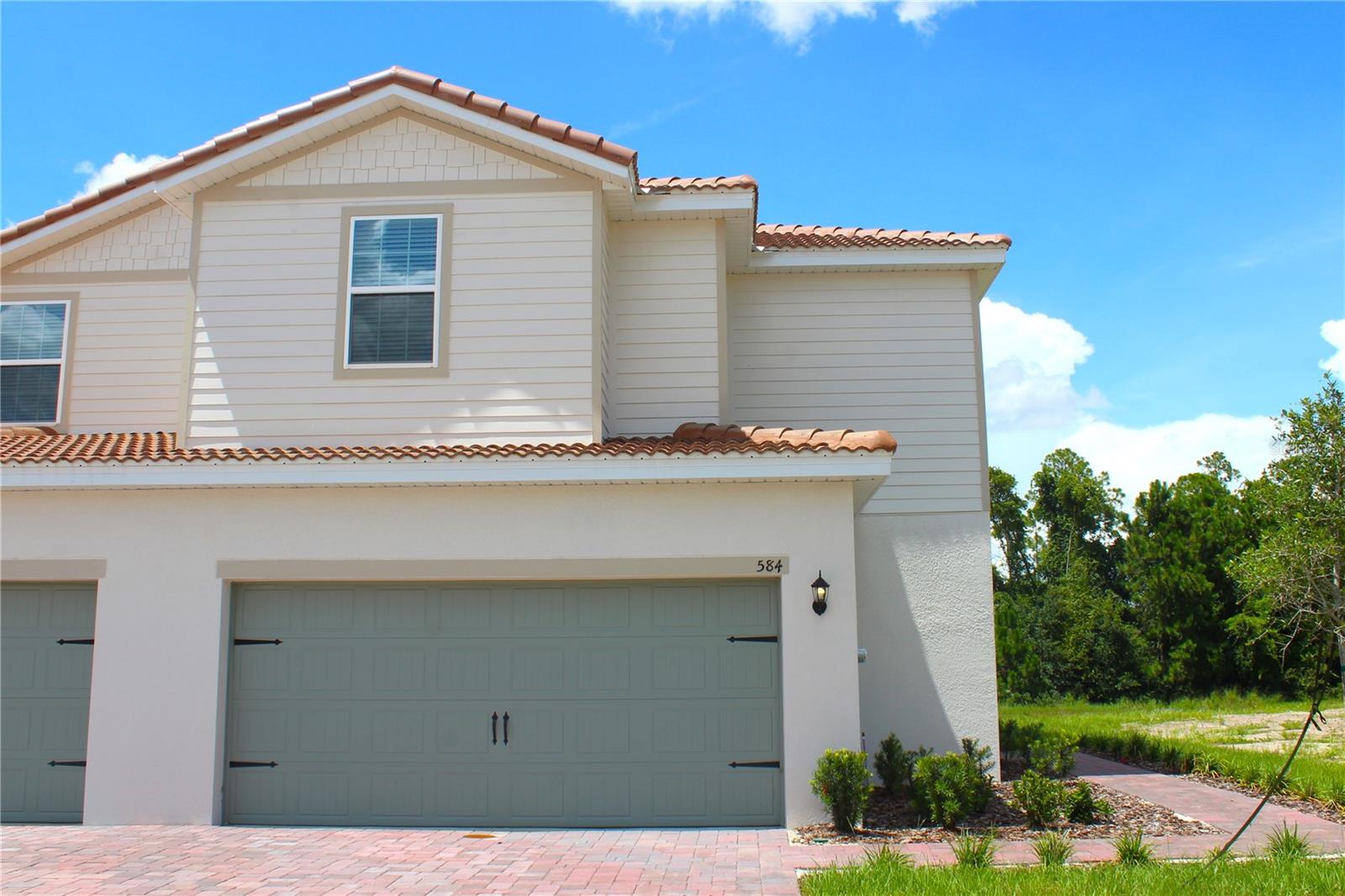 Discover the Glades floor plan by LGI Homes, now available at Noah Estates in Tuscany Preserve. This beautiful two-story design offers 3 bedrooms, 2.5 baths, and a flexible bonus room to suit your lifestyle needs. Every home comes complete with our signature CompleteHome™ package, providing premium finishes and modern conveniences at no additional cost. Enjoy a full suite of Whirlpool kitchen appliances, 36” upper cabinets with elegant crown molding, LED ENERGY STAR lighting, and spacious walk-in closets in every bedroom. The thoughtfully designed kitchen features a large island with breakfast bar seating and a generous pantry, while the private owner’s suite includes a dual-sink vanity, step-in shower, linen closet, and walk-in closet. Perfect for hosting, the open-concept living spaces make entertaining effortless. Tuscany Preserve residents benefit from outstanding amenities including a resort-style swimming pool, heated spa, fitness center, clubhouse, splash pad, and sports courts. Just minutes away, Poinciana’s parks, trails, and recreational areas provide even more to explore. With move-in ready homes, builder-paid closing costs, low or no down payment options, and thousands of dollars in included upgrades, the Glades delivers style, comfort, and exceptional value.