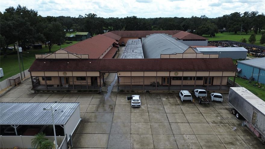 *** Seller willing to help finance ***
Newly zoned ALL commercial! This unique property has been built at and mostly above standards over the last 40+ years. With almost 20,000 sqft climate-controlled and another 30,000+ for storage, this property can handle it all. The front building was previously residential and can be used for offices or more. 5,000 sqft is set up to be a local tool and supply store, already stocked. There are several built-out offices as well as an executive suite that includes a kitchenette and a full private bathroom. The entire property is gated with a secondary gate for the main building. 53' trailers fit between the buildings into the main area. Behind the main building is room for more storage, parking, etc. Minutes from major interstates and convenient to Tampa and Orlando, don't miss the chance to own this prime property!