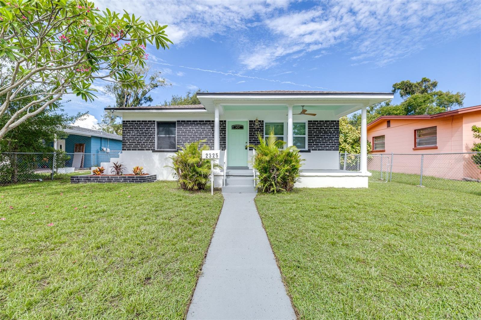 One or more photos has been virtually staged. Welcome to this MOVE-IN READY, completely remodeled 3-bedroom, 2-bathroom home, perfectly situated in the heart of South Saint Petersburg! From the moment you arrive, the inviting large front porch sets the tone for the charm and comfort this home offers. Step inside to a spacious living area filled with abundant natural light, creating a warm and welcoming atmosphere. The tastefully updated kitchen is a true highlight, featuring quartz countertops, solid wood cabinetry, and stainless steel GE appliances—a perfect blend of style and functionality. Just off the kitchen, you’ll find a versatile flex space that leads to the brand-new primary suite, complete with its own private full bath. On the opposite side of the home, the thoughtful split floor plan offers two generously sized bedrooms, another full bath, and a convenient laundry area, providing both privacy and ease of living. The fully fenced lot offers plenty of outdoor space and includes a stone driveway with alley access, making parking and storage a breeze. This home is truly turn-key, with extensive updates that include: New AC and ductwork, all new electrical panel and wiring, new plumbing, tankless water heater, brand-new windows, new flooring, fresh interior and exterior paint, and modern fixtures throughout. Located in an amazing central location, you’ll be just minutes from vibrant downtown St. Petersburg, hospitals, public transportation, major highways, and the world-famous Gulf Coast beaches. With all the work already done for you, all that’s left is to move in and start enjoying the Florida lifestyle. Don’t delay—schedule your private showing today!