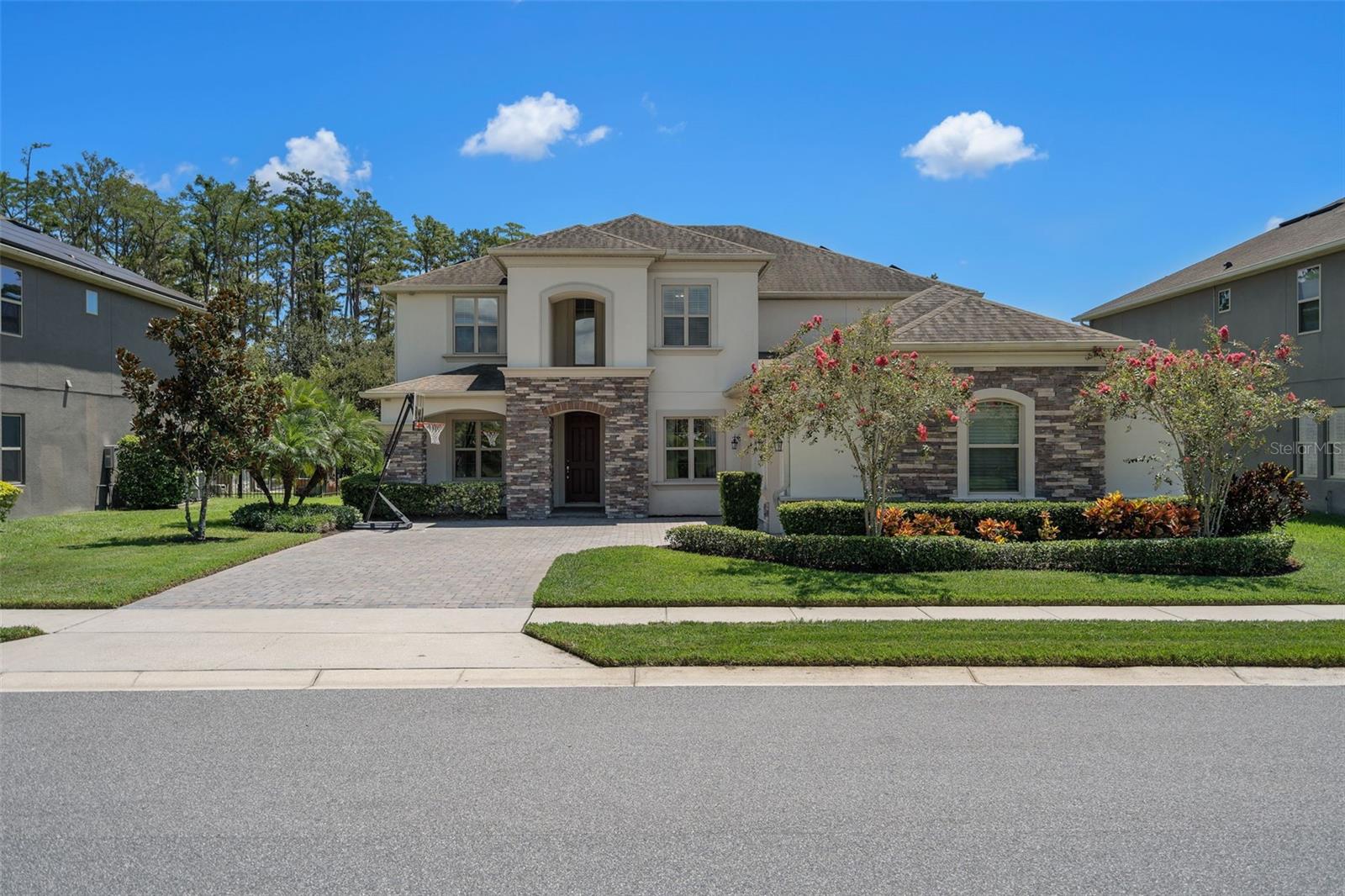 Gorgeous pool home in the highly desirable Cypress Reserve community! 4 bedroom, 3.5 bath with a sprawling 4000 sf and 3 car garage. Inside you will be greeted by tall soaring ceilings, tall windows with lots of natural light, and a spacious open floorpan with the staircase and balcony anchored in the center of the room serving as an elegant focal point. The entry has a formal dining area to the left and an office with French doors to the right. The stunning kitchen is a chef's dream and is the center of attention for entertaining and gatherings. Enjoy cooking your favorite meals in the magazine worthy kitchen with premium stainless steel appliances, gas stove, beautiful white cabinets, butler's pantry, granite countertops, modern backsplash, and a large island. You will notice the architectural details including arched walkways, tray ceilings, 8 foot doors and wood vinyl floors. Entertain family and friends in the large living area while overlooking the serene pool and conservation view. Retreat to the primary bedroom on the first floor with plenty of space for a sitting area, with duel walk in closets, and a beautiful en suite with a garden tub, large shower and duel vanities. On the second floor you will find the other 3 large spacious bedrooms and a huge loft space that is perfect for a game room or home theater. The loft has a bathroom and another room that can be used for an additional home office/flex space or home gym. The guest bath offers duel sinks and a private tub/shower combo. This home is surrounded by conservation land, no construction is allowed in front of or behind this home, so you will always have a tranquil and clear view outside your windows. Throw a barbecue and float around in the salt water pool with waterfall features and a gorgeous view of nature. Energy efficiency with a solar system that is owned outright, Ecobee smart thermostat, tankless water heater, whole home water system and fresh interior paint. In walking distance to Sunridge Elementary and Middle Schools. Close to downtown Winter Garden with all of its great dining options and conveniently located close to the 429 and Florida's Turnpike. Schedule your showing today for this stunning Winter Garden home and make it yours today!