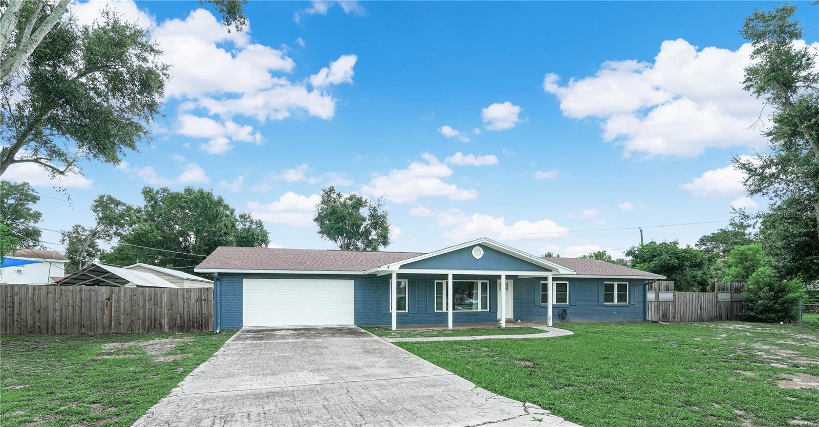 This beautifully updated and spacious 3 bedroom/ 2 bath pool home on a half acre lot in a small neighborhood setting with no HOA may be just what you are looking for. And, if that sounds good you will be delighted to see all that this home has to offer. The freshly painted walls and new easy care vinyl plank flooring throughout definitely makes this home move-in ready. There is a 12 x 16 formal living room plus the 13 x 18 family room with sliding door to the amazing, must see, covered deck and screened pool area. The 16 x 32 pool is heated and was added in 2018. The kitchen was updated in 2021 and is a delight, offering an array of white cabinets, granite countertops, a pantry that surrounds the refrigerator, and a cozy breakfast area. All appliances are stainless including the washer and dryer in the separate laundry room. The formal dining room is just off the kitchen and it is beautifully accented with crown molding and a chair rail. The primary bedroom measures 15 x 11, plus a walk in closet and full updated bath. Each bedroom is spacious enough for not only a bed, but also for additional furniture and room to relax. All of this plus a 20 x 21 attached 2 car garage with 200 amp service. Within the fenced backyard there is a (2022) 18 x 30 metal shed with metal roof and overhead door , an 18 x 20 carport with metal roof, and an RV pad with power and sewer hook up. The seller is also including a portable generator which runs on gas or propane and has the capacity to run the entire home in case of power failure. All of this in a location with a small home town feeling, but in close proximity to interstate and local highways.