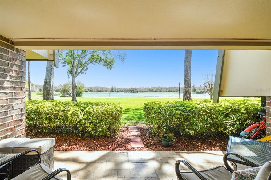 TWO BEDROOM/TWO BATH “C” UNIT - Ground Floor with million-dollar view of Innisbrook Lake! Paradise awaits with resort-style living at its finest. You will love this gorgeous 2-Bedroom/ 2-Bath condo with an UNOBSTRUCTED VIEW of the lake and Island Golf Course. All this and much more in Innisbrook Golf and Spa Resort, a privately gated Resort in Palm Harbor. This unit is recently RENOVATED FROM TOP TO BOTTOM, tastefully decorated, some furniture is "negotiable" Renovations include PELLA PREMIER IMPACT AND HURRICANE RESISTANT windows and doors which include a transferable 20/10-year warranty. As you enter this condo, you can appreciate the open concept kitchen, living and dining area. Enjoy the enlarged kitchen with classic high-end cabinets as well as extra storage, with stunning granite counter tops with LARGE ISLAND/BREAKFAST BAR with four bar stools and a pantry with pull-out drawers and appliance garage for coffee maker and toaster. HIGH-END APPLIANCES include induction stove, fridge with ice & filtered water, dishwasher and microwave. Beautiful Travertine Flooring in a French pattern matches throughout the kitchen, living room, patio, hallways and closets, as well as new flooring in both bedrooms. The guest bathroom has been completely renovated as well as the master bath has been enlarged and renovated with a vanity with double sinks. Other improvements you will appreciate are the Crown Molding throughout; Raised Ceiling in the kitchen; Wine Storage Rack and Mini Bar with Wine Fridge; LED pot lights throughout; and LED lights above and below kitchen cabinets adding ambience. An added benefit of this location is the Island Clubhouse is right next door featuring the Turnberry Pub and Island Pool with hot tub, as well as a ground floor coin-free laundry just a few doors away, or, you have the option to install your own washer dryer in the water heater closet (to be installed by a licensed plumber and permits are required).
 Several levels of club memberships are available for purchase to participate in the Innisbrook amenities. Several levels of club memberships are available for purchase to participate in the Innisbrook amenities. Innisbrook condo owners have the option to participate in the Resort’s optional Rental Pool program (condos in lodges 1-24 only). 
Situated on 800 wooded acres of rolling hills and 70 acres of lakes, Innisbrook, A Salamander Golf and Spa Resort is located just 25 minutes from Tampa International Airport. Innisbrook features sixty-three holes of golf, including the PGA’s Valspar Championship Copperhead course, 280spacious guest suites and rooms, 5 restaurants and 3 bars including the FAIRWAYS COFFEE AND WINE BAR featuring STARBUCKS coffee, 10 Har-Tru TENNIS courts, 4 Hard-court PICKLEBALL Courts, 3 Indoor RACQUETBALL courts, a full-service Salamander SPA with 12 treatment rooms and Fitness Center, 6 Swimming POOL Complexes, and 2 Conference halls.