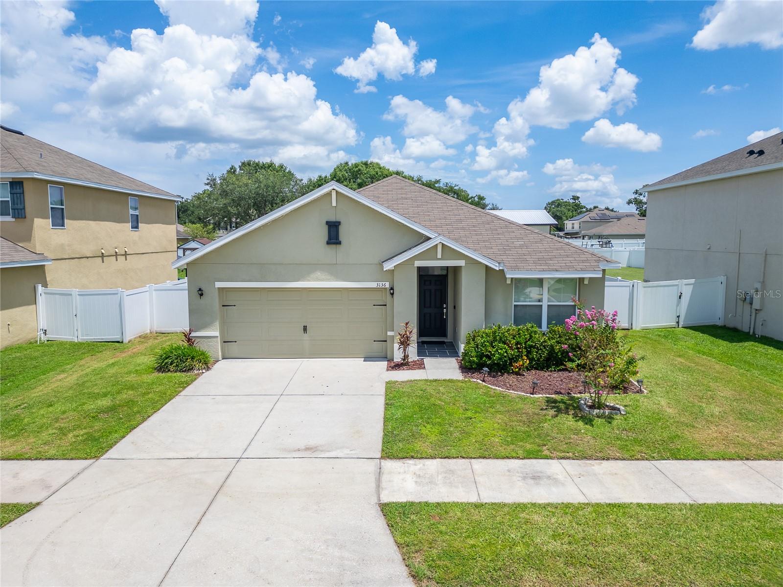 Charming and Contemporary, adorable and affordable Built in 2017, this beautifully maintained home sits on one of the largest lots in the community and showcases an open-concept floor plan and exceptional attention to detail throughout. The stylish kitchen features wood cabinetry, a newly installed backsplash, a spacious pantry, generous counter space, and a large island ideal for entertaining or casual dining. Upgrades include a newer kitchen sink and modern light fixtures (2024) as well as durable laminate wood flooring in the living areas and kitchen (2020). The master suite offers a spacious walk-in closet, an additional linen closet, and a well-appointed ensuite bath with dual sinks. Additional highlights include a separate laundry room, tile flooring in both bathrooms, a two-car garage, an enclosed lanai, and a fully fenced oversized backyard. Low HOA and one homesite away from community playground . Located in Plant City—home of the renowned Strawberry Festival—this residence combines small-town charm with convenience, offering easy access to I-4 and SR 60, as well as nearby shopping, dining, schools, churches and more. This home is move-in ready and a perfect fit for a variety of buyers—schedule your private tour today!