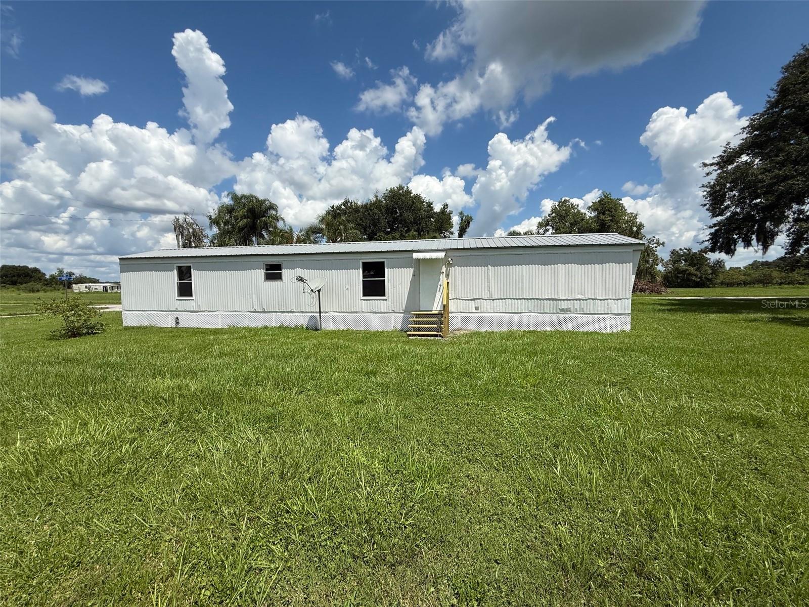 Spacious 3-bedroom, 2-bath single-wide mobile home located in a small, quiet country park on a large corner lot. The home features indoor washer/dryer hookups and is move-in ready. At the time of move-in, a $75 tenant processing fee is due along with rent and any required security deposit(s). Tenants must have a monthly income of at least three times the rent, a minimum credit score of 600, no prior evictions, and will be subject to credit and background checks. No pets allowed. Enjoy peaceful country living while still being conveniently close to town.