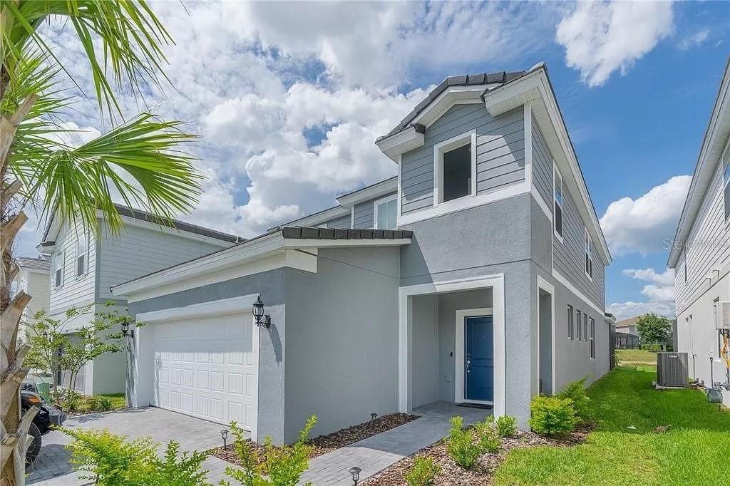 Photo of 7243 Oakmoss Loop, Davenport, FL 33837 (MLS # O6422329)