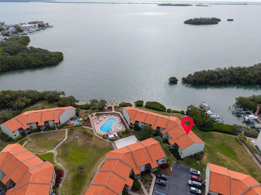 Welcome to a rare investment opportunity in Tierra Verde, Florida, where short-term rentals and transient use are permitted—something increasingly difficult to find in Pinellas County real estate. Located in the desirable Holiday Island / Wander Residences waterfront community, this top-floor, end-unit 2-bedroom, 2-bathroom condo offers flexibility for daily rentals (3-day minimum), personal vacation use, or full-time living. The current owner has operated the property successfully as a high-performing Airbnb, and rental records are available upon request.

If you’ve been searching for a condo near St. Pete Beach or Fort De Soto that allows short-term rentals, this is an exceptional opportunity to own a property that can generate income while still enjoying it yourself. Buy now, generate cash flow, vacation when you want, and continue operating a successful short-term rental in Tierra Verde.

This bright and welcoming condo features a well-designed layout with beautiful side water views from the living room, primary bedroom, and private balcony, creating the perfect setting for relaxing after a day at the beach. The unit is super clean, freshly painted, and move-in ready with tile and luxury vinyl flooring throughout. Both bathrooms have been nicely updated, and the eat-in kitchen with breakfast bar offers functionality with room for future customization. Furnishings are optional, making it easy to create a turnkey rental property or vacation retreat.

The Holiday Island / Wander Residences community offers a true resort-style waterfront lifestyle with amenities that are highly attractive to vacation renters and residents alike. Features include a heated pool and jacuzzi, tennis and pickleball courts, boat dock with slips available for rent, day dock, kayak storage, bike storage, BBQ deck, and clubhouse with fitness room, billiards, and laundry facilities. The community is also pet friendly, adding even more appeal for guests and owners.

Location is a major highlight. Tierra Verde is one of the most sought-after waterfront communities in the Tampa Bay area, just minutes from the pristine beaches of Fort De Soto Park, St. Pete Beach, and Pass-a-Grille. Residents and visitors enjoy easy access to marinas, waterfront dining, and local favorites such as Billy’s Stone Crab and the Island Grille. The vibrant culture of Downtown St. Petersburg—known for its museums, nightlife, restaurants, and waterfront parks—is only about a 15-minute drive away.

Whether you are searching for a Tierra Verde investment property, a waterfront condo with strong rental income potential, or a Florida Gulf Coast vacation home, this property offers flexibility, location, and proven income performance.

Opportunities like this—a fairly priced waterfront condo in Pinellas County that allows short-term rentals and transient use—are extremely rare. Don’t miss the chance to own your own piece of paradise in Tierra Verde.