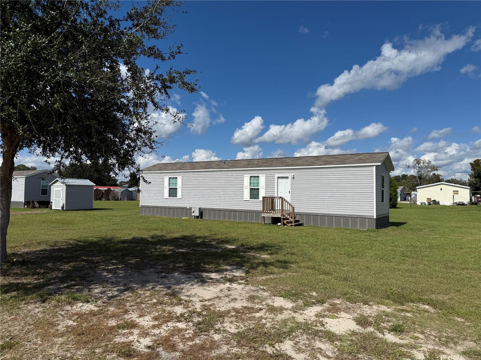 Welcome home to this 2 bedroom 2 bath single wide manufactured home on an oversized lot in desirable Montgomery Acres. Located a short distance from I-75 making north and south travel a breeze. Also approximately 15 minutes from The Villages providing shopping, dining, and nightly entertainment. For the outdoor enthusiast please note there are several WMAs near by and several public boat ramps providing access to beautiful Lake Panasoffkee and the Withlacoochee river.