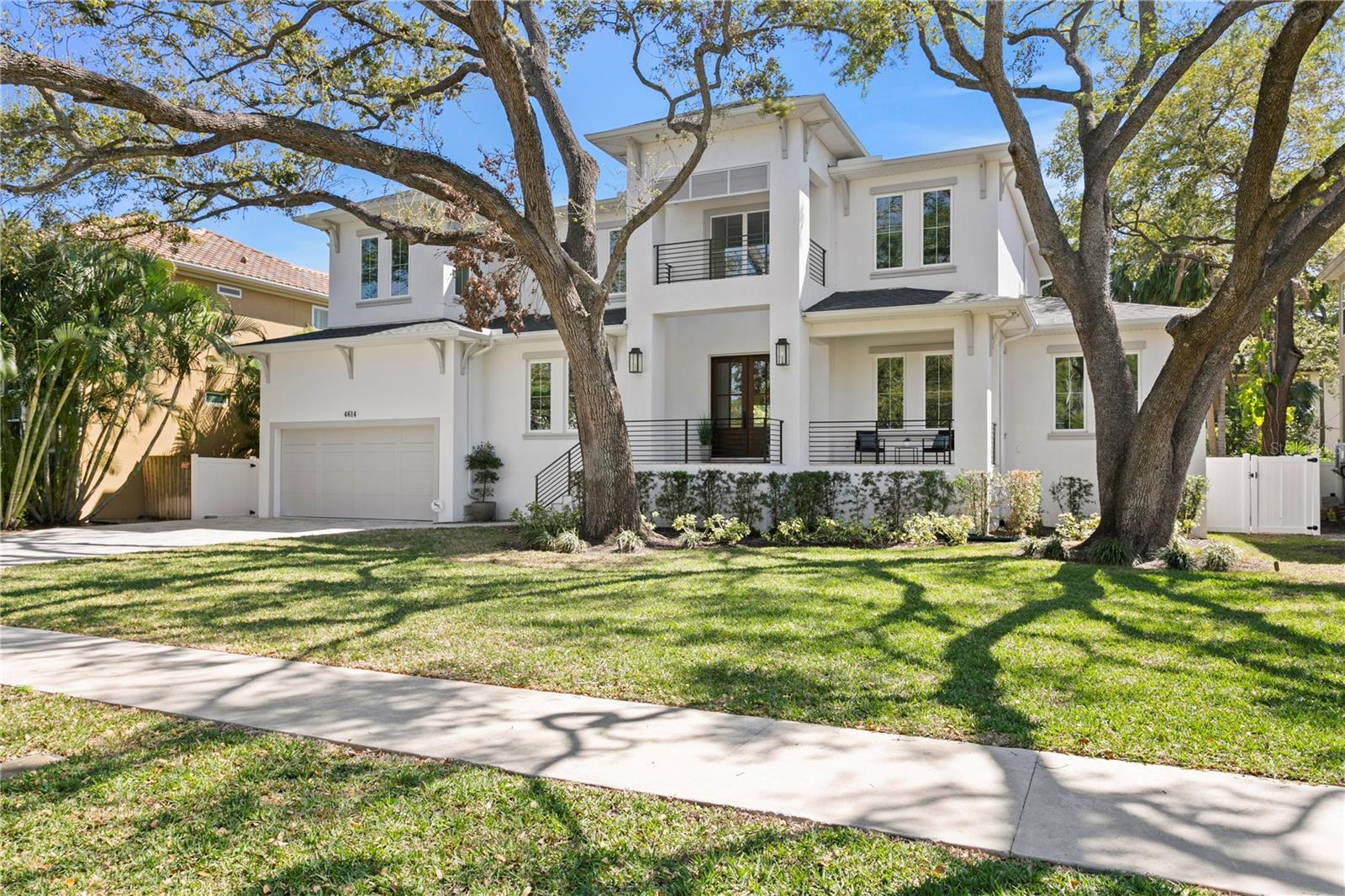 Every detail of this custom-built Brookshire Homes residence has been meticulously designed with elegance and functionality in mind. Nestled on an oversized lot (90X143, 12,870 sf lot) in the heart of South Tampa's Sunset Park, this exceptional home features 5 bedrooms, 6 full bathrooms, an office, a bonus room, a pool, and a four-car garage. As you step inside, a grand two-story foyer welcomes you with soaring ceilings, flanked by a formal dining room and a private office space/formal living room. Sunlight pours into the open-concept main living area and kitchen through stunning French doors and expansive windows, offering picturesque views of the pool, lanai, and lush backyard outside. Custom touches abound, including wood floors, crown molding, coffered ceilings, beautiful light fixtures, and more. The chef's kitchen is a masterpiece of design, boasting a six-burner gas range, oversized Thermador refrigerator, hidden walk-in pantry with built-in shelving, massive kitchen island with storage, eat-in kitchen space, and a butler's pantry with a full-size wine fridge. The living area is anchored by a cozy gas fireplace. A spacious guest suite with a private marble tiled bathroom is tucked away on one side of the first floor, along with a large bonus/flex room overlooking the pool and backyard, offering direct outdoor access and endless possibilities. On the opposite side, a full bathroom with easy access to the pool, first-floor laundry room, mud-room, and storage closet provide additional convenience. Upstairs, the grand primary suite offers a separate sitting area, spa-like en-suite bathroom, and an expansive walk-in closet with an island, designer built-ins, and direct access to the spacious second-floor laundry room. Three additional upstairs bedrooms each feature en-suite bathrooms with stunning tile designs & spacious closets with custom storage built-ins. The outdoor oasis is designed for entertainment, with a covered porch, outdoor kitchen, and spacious pool deck - perfect for embracing the ultimate Florida lifestyle. Located within the highly sought-after Plant High School district, this home is positioned on a quiet, upscale street in a prime South Tampa location.