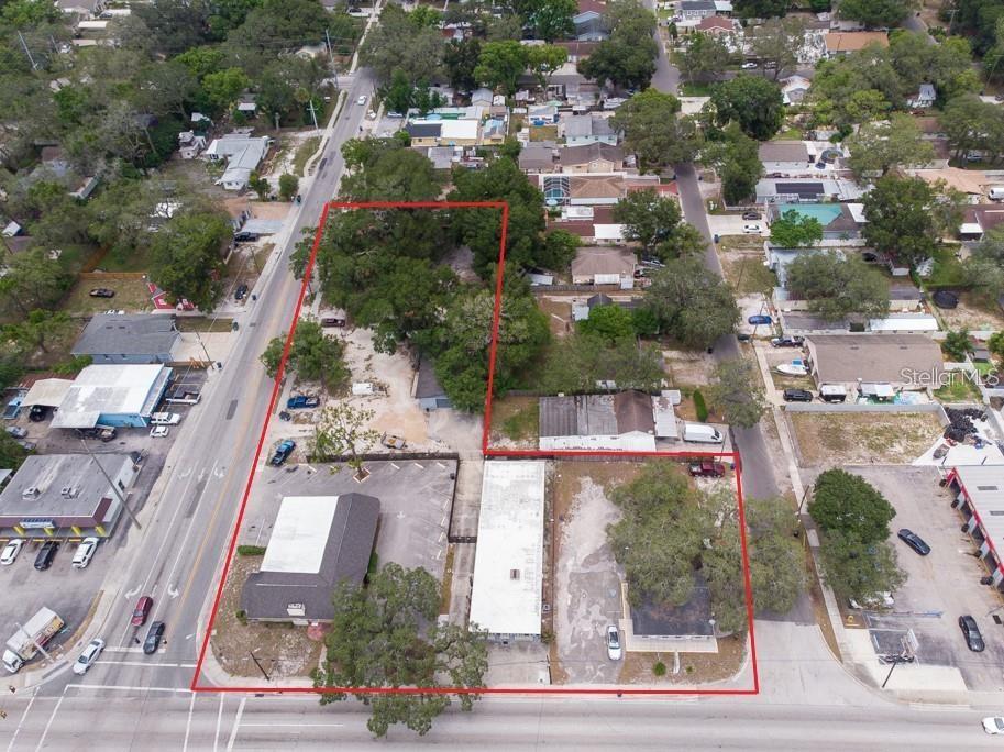 Calling All Developers! Come check out this incredible redevelopment opportunity for 1.29 Acres on a prime, lighted corner with high traffic and high visibility. This fantastic property boasts 243' of frontage along W. Waters Ave and 352' of frontage along N. Boulevard. There are 4 buildings totaling 9,314 square feet on the property, which are currently being operated as retail, warehouse, and religious assembly. Included in the sale of this property are the following 6 parcels: 801 W. Waters Ave, 803 W. Waters Ave., 809 W. Waters Ave, 8401 N. Boulevard, 8405 N. Boulevard, and 8409 N. Boulevard. The possibilities are endless for the immediate redevelopment of this amazing property!