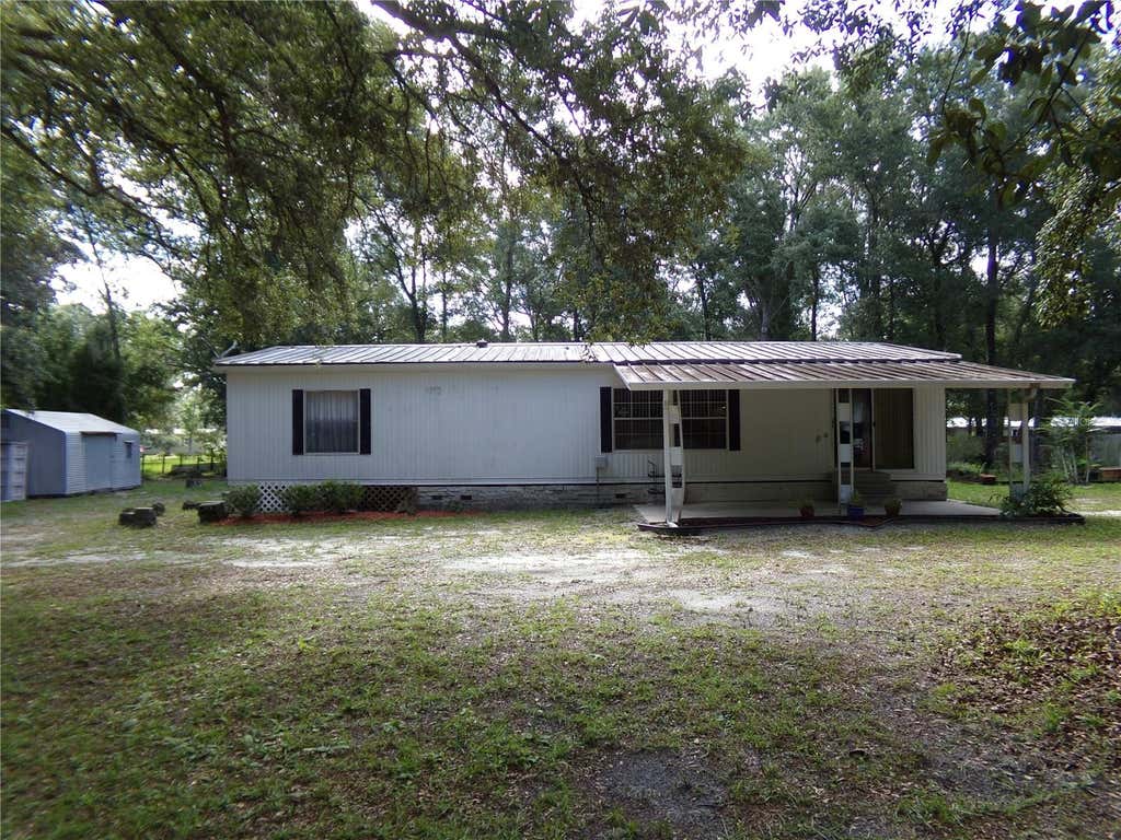 Photo of 12199 SW 44th Drive, Webster, FL 33597 (MLS # W7887503)