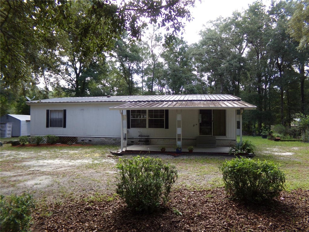 Photo of 12199 SW 44th Drive, Webster, FL 33597 (MLS # W7887503)