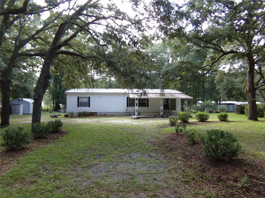 Photo of 12199 SW 44th Drive, Webster, FL 33597 (MLS # W7887503)
