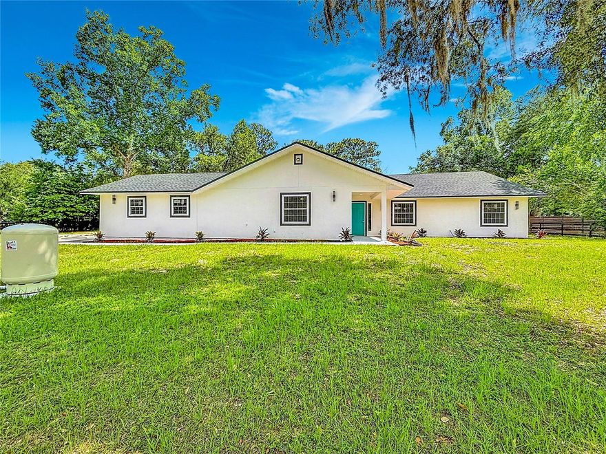 Completely renovated from the studs up, this move-in-ready 4-bedroom, 3-bathroom home sits on 1.03 fully fenced acres with no HOA. Every major component has been updated and permitted, including the roof, flooring, walls, ceilings, kitchen, and bathrooms. High-end finishes throughout create a modern, comfortable living space, while the expansive lot provides privacy and plenty of room for entertaining, pets, recreational vehicles, or future outdoor improvements. Conveniently located just 20 minutes from Downtown Ocala, this vacant home offers the perfect blend of updated living, usable land, and freedom from HOA restrictions.