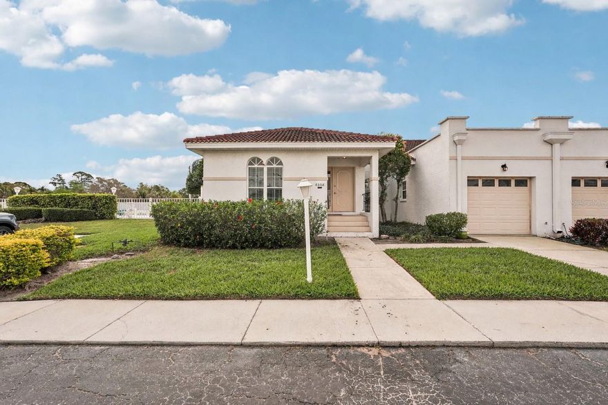 One or more photo(s) has been virtually staged. This exceptional villa offers the ideal combination of space, layout, and location. Just under 8 miles from Anna Maria Island, this 3-bedroom, 2-bath villa with an attached garage is the perfect place to call home. The community pool is next door—just step outside, walk around the corner, and enjoy your tropical poolside retreat. Inside, you’ll love the vaulted ceilings and open living/dining floor plan that flows seamlessly to the spacious screened lanai—perfect for relaxing after a day at the beach or a round of golf. Stunning large-format diagonal tile flooring runs throughout, complementing a wide range of styles and décor. The kitchen features beautifully updated tall cabinetry, easy-care quartz countertops, and breakfast bar. A large vaulted primary bedroom leads into the en suite bath with double sinks, and updated tile shower. Additional updates include a Rheem A/C system installed in 2021, along with plantation shutters and slider blinds added in 2022. The HOA covers cable, internet, garbage and recycling and exterior maintenance (including the roof!) making for easy, low-maintenance paradise living.