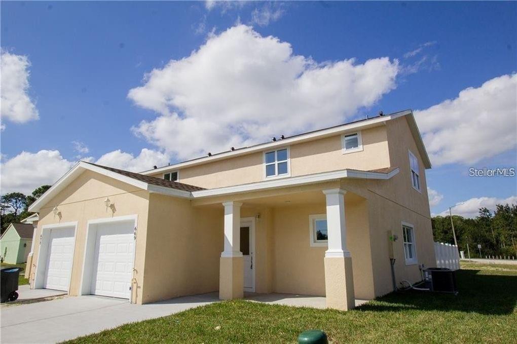 Photo of 669 Lake Shore Parkway, Davenport, FL 33896 (MLS # TB8545913)