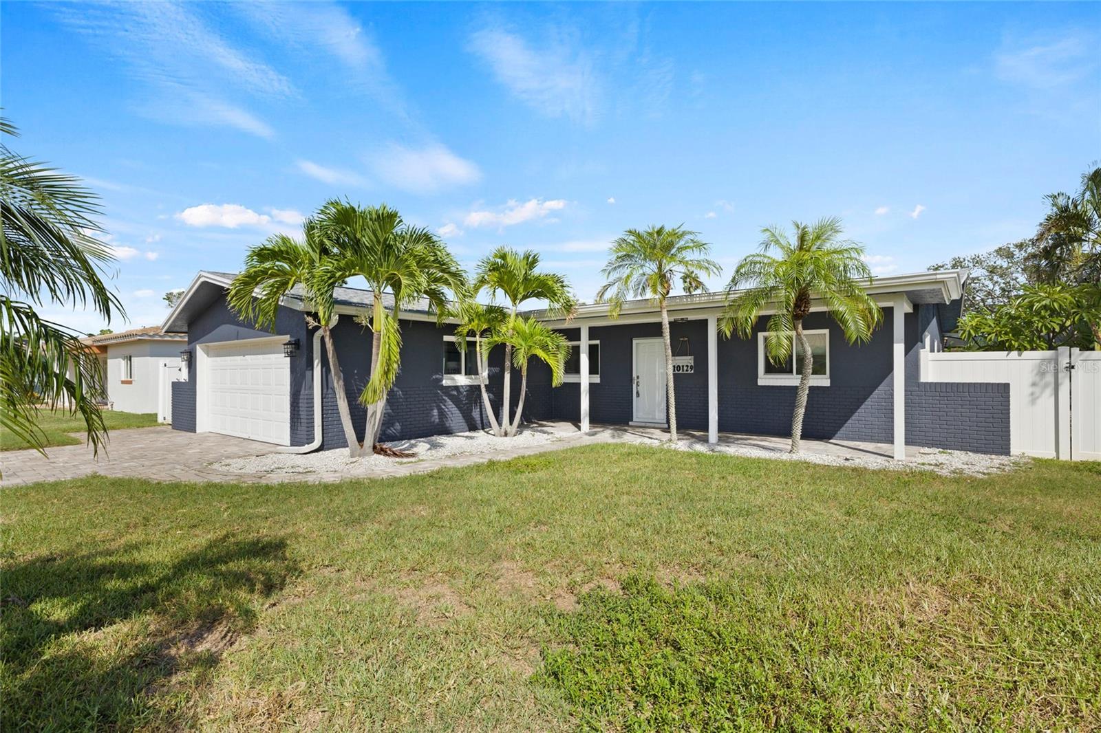 Welcome to your dream beachside retreat! Located in the heart of Treasure Island, this beautifully renovated 3-bedroom, 2-bathroom home with a spacious 2-car garage offers the perfect blend of modern upgrades and coastal charm — just MINUTES from the Gulf beaches. Step up to this cute, beachy home and enter into a light-filled open floor plan where the living room, dining area, and kitchen flow seamlessly together — ideal for both relaxing and entertaining. The kitchen is a chef’s delight, featuring brand-new stainless steel appliances, sleek countertops, all-new cabinetry, and a large center island perfect for gathering. The living room invites cozy movie nights, while just off the main space, the Florida room offers a stylish dry bar with a wine fridge — your new favorite spot for happy hour or weekend brunch. The airy primary suite boasts a walk-in closet and a spa-like ensuite bathroom complete with a towel warmer for a touch of luxury. On the opposite side of the home, you'll find two well-sized guest bedrooms and a sleek, fully updated guest bathroom. Step outside to your private backyard oasis — fully fenced and featuring a sparkling pool ready for sunny Florida days and evening swims. Additional upgrades include a new roof, new water heater, and a 2017 HVAC system, ensuring a move-in-ready experience with peace of mind. All this located under 10 minutes to the beach and just 20 minutes from downtown St. Petersburg, with easy access to shopping, dining, and all the best the area has to offer. Don’t miss this turnkey Treasure Island beauty — schedule your private tour today!