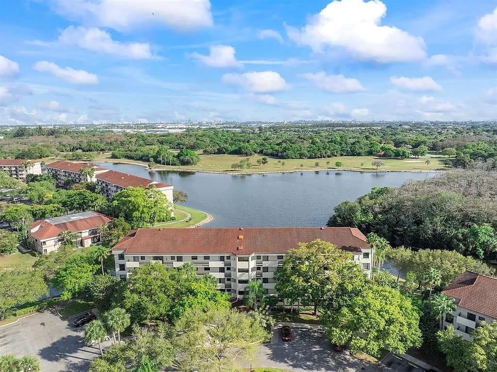 DISCOVER THIS METICULOUSLY MAINTAINED 2-bedroom, 2-bathroom 2nd Floor Corner property with a beautiful lake view! Featuring brand new flooring and a bright, clean interior, with its indoor washer/dryer room. This property is move-in ready and showcases pride of ownership throughout. The open layout offers comfortable living and dining spaces, perfect for both relaxation and entertaining.
Enjoy serene views, giving you the peace and tranquility you’ve been searching for. This home is easy to show and ready for its next owner to fall in love. Don’t miss this opportunity to own a clean, updated, and well-cared-for home in a desirable location! Enjoy such amenities as fitness center, tennis courts, clubhouse, pool and sauna. Close to Tradewinds Park which includes horseback riding, playgrounds, picnic areas, Holiday tree lighting, also Promenade at Coconut for vast dining options and open-air shopping. You will also find Butterfly World a short drive away with easy and quick access to I-75.