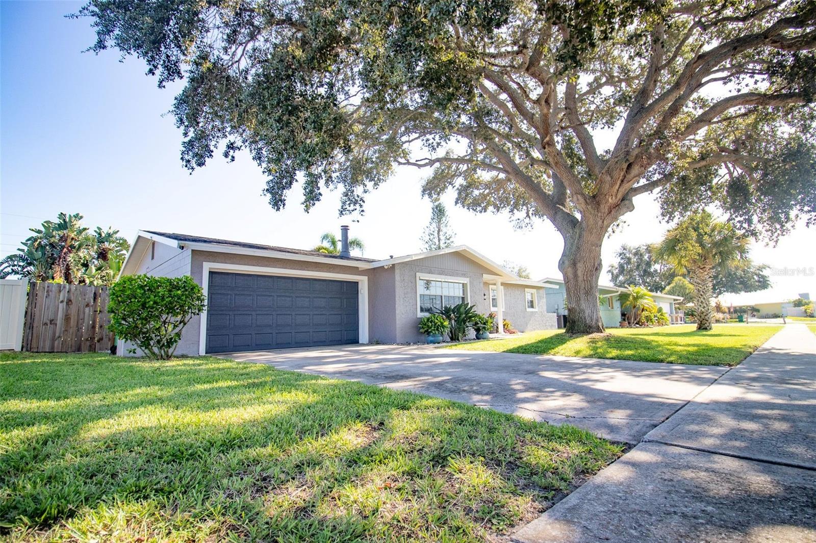 Live the Florida dream in this stunning Merritt Island pool home! Take a dip in the pool (resurfaced 2021) surrounded by lush tropical landscaping & feel like you’re on vacation every day! Immaculately maintained & updated so you can buy with peace of mind: generator hookup, hurricane shutters, roof 2017, HVAC 2019, HWH 2016, new plumbing (no cast iron!) 2023, smart entry garage door & irrigation (2023). The custom kitchen shines with leathered quartzite counters, a gas range with convenient double oven, pull-out shelves & spice rack, and the built-in beer taps will impress when you’re entertaining. A powered outbuilding (110V/220V, AC) gives you extra space & tops it all off - perfect for a workshop, office, or pool house. Washer/dryer, refrigerators & generator convey. Minutes from KSC, beaches, shopping, dining & cruise terminals. Easy access to the Beach Line will get you to the airport & theme parks in no time. Love where you live - schedule your showing today!