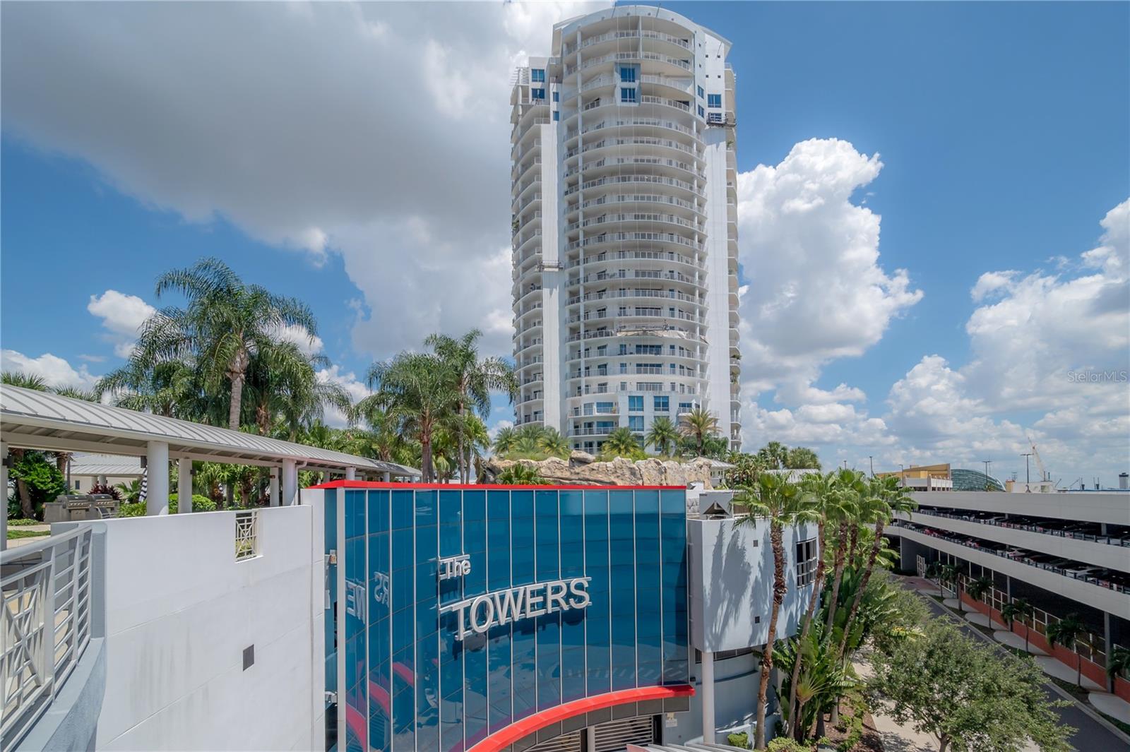 Discover contemporary elegance in this beautifully renovated 20th-floor residence showcasing stunning views of Water
Street, Harbor Island, Garrison Channel, and the downtown skyline. Offering 1,733 sq ft of open living space, this unit
features newer porcelain tile floors throughout, a sleek updated kitchen with marble countertops and white cabinetry, and
floor-to-ceiling windows with electric blinds. The luxurious primary suite boasts a modernized ensuite bath with dual sinks, separate tub with a walk in shower, custom built
walk-in closet, and sliding doors to the expansive 1,322 sqft wrap-around terrace, updated with new pavers—perfect for
entertaining, enjoying the sunrise or relaxing outdoors. Renovated bathrooms add sophistication throughout. Residents
enjoy resort-style amenities including a tropical pool and spa, 24-hour concierge and security, and two rooftop dog
walks. This unit comes with two assigned garage parking spaces. Ideally located, with walkable access to Sparkman
Wharf, the Tampa Riverwalk, Channelside, top dining, as well as concerts and Lightning hockey at the nearby
Benchmark International Arena.