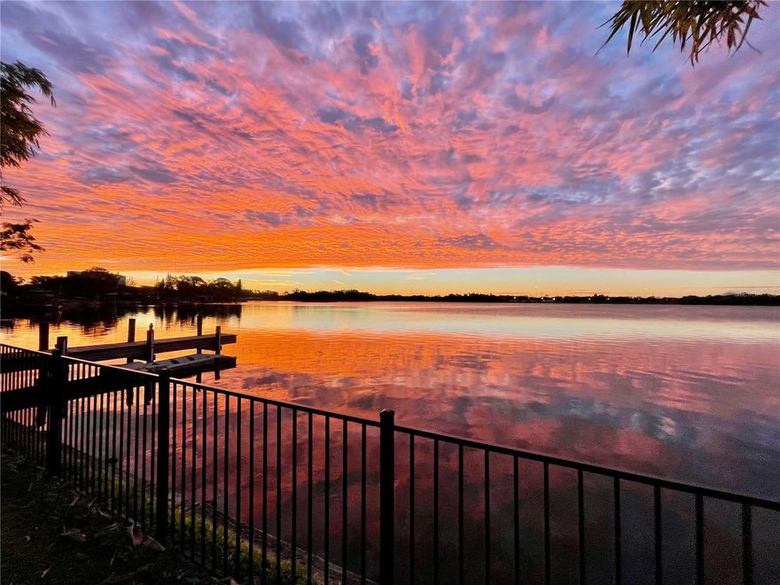Waterfront Nature Lover's and Craftsman's Paradise - The Mid-Century Modern Lakefront Home overlooks a 100 acre private recreation lake located 6 miles from downtown Tampa and 1 mile from the Hardrock Hotel and Amphitheater Complex. A rental gold mine or your forever home. This sprawling 3-Bedroom/ 2 Bathroom home boasts beautiful vaulted tongue and groove stained wood ceilings and Terrazzo floors, restored throughout. Vast natural light floods the home with sparkling reflections from the lake and blue skies thru the 33 feet sliding glass door on the back of the house. Large Bedrooms with Vaulted Wood Ceiling and cedar lined closets with double sliding closet doors. 2nd Bath features dual sinks and Deep Soaking Tub feed from a Instant Hot Water Unit adjustable to your liking. The Kitchen is a chef's playground with a large double faucet sink with food prep accessories. The large 36" wide Italian Oven with stainless back splash never disappoints. The kitchen overlooks a Large 600 SF screened Lanai with vaulted insulated ceiling, Pool Table and Bar. Just off the Lanai is a large workshop and storage room, approx 13' x 20', giving you storage/ small shop or could be covered to another Bedroom. The spacious 2-Car Garage with opener is full of natural light from view of the lake and full wall of windows. The Exterior of the house is Block and Stucco with Brick accents on the front that contrast the front porch planter and tile floor. The eight covered front porch over the Circular drive and central landscaping feature with accent wall as well as several of flowerbeds with mature landscaping. The roof of the house is metal which will last you lifetime. The fenced backyard overlooking lake the is a recreational and entertaining paradise. The long concrete sidewalk that you from the lanai all the way to dock and Kayak Launch area. There are (2) Large Covered open air Patios, One is walk-out from the Master Bedroom and the other of the lanai. Both have power, water and there is an outdoor shower and wash down sink. There house truly is gem and has been restored to new condition. New A/C, Upgraded Electric, polished unrestored Terrazzo floors thru-out, bathroom and kitchen models. With the Exterior Block Walls, Metal Roof and Interior Terrazzo Floors and Plaster Walls the house is truly indestructible. Come take a look at this Florida Waterfront Dream home today!